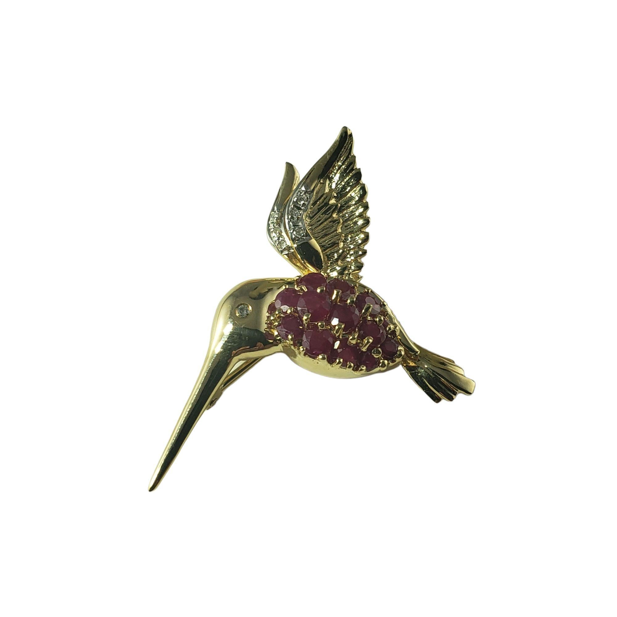 Vintage 14 Karat Yellow Gold Ruby and Diamond Brooch/Pendant JAGi Certified-

This lovely hummingbird brooch features seven round brilliant cut diamonds and 13 round rubies set in beautifully detailed 14K yellow gold.  Can be worn as a brooch or a