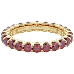 14 Karat Yellow Gold Ruby Eternal Fit Eternity Band Features 2.53 Carat of Red