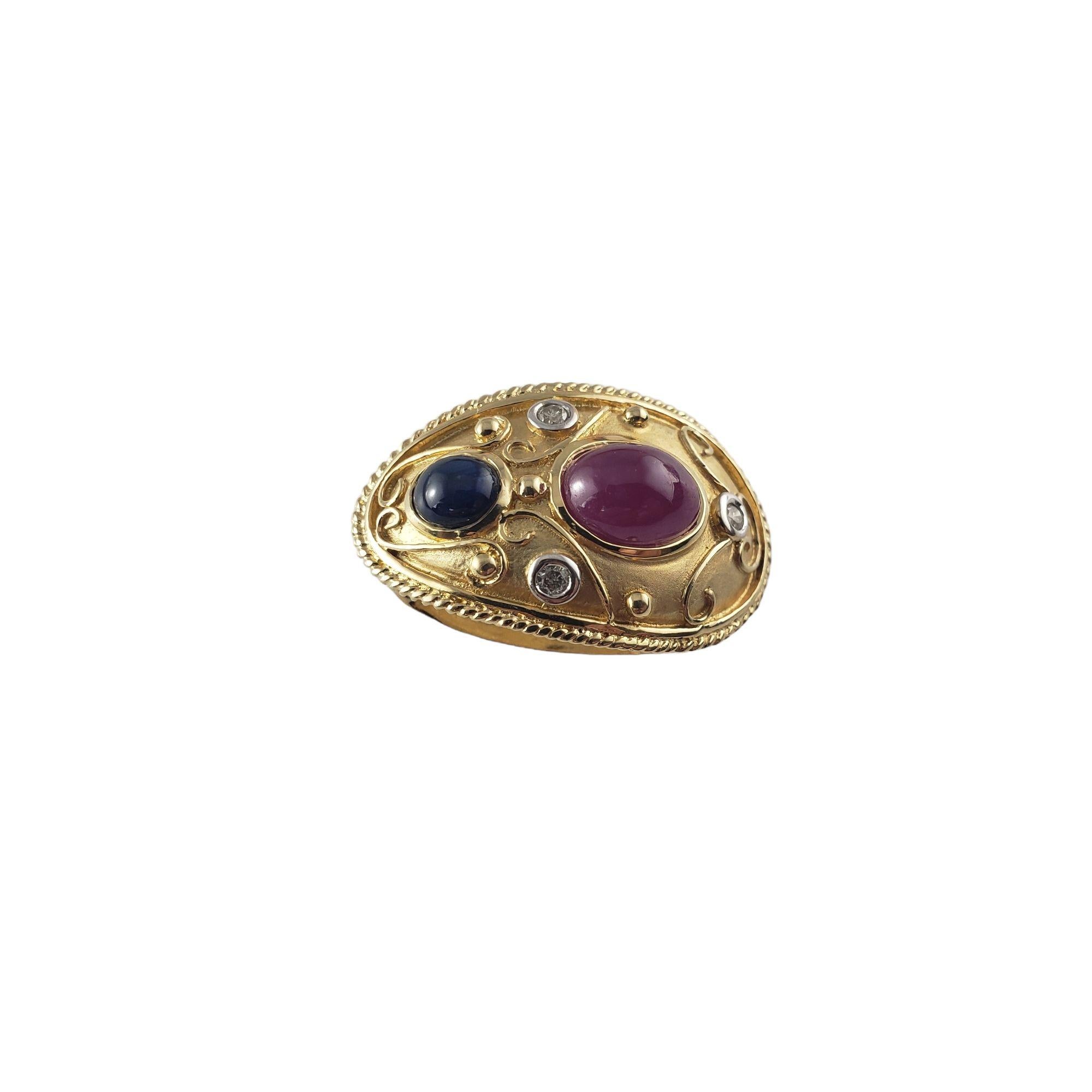 Vintage 14 Karat Yellow Gold Ruby, Sapphire and Diamond Slide Pendant-

This stunning slide pendant features one oval cabochon ruby (7.8 mm x 5.8 mm), one oval cabochon sapphire (5 mm x 4 mm) and three round brilliant cut diamonds set in beautifully