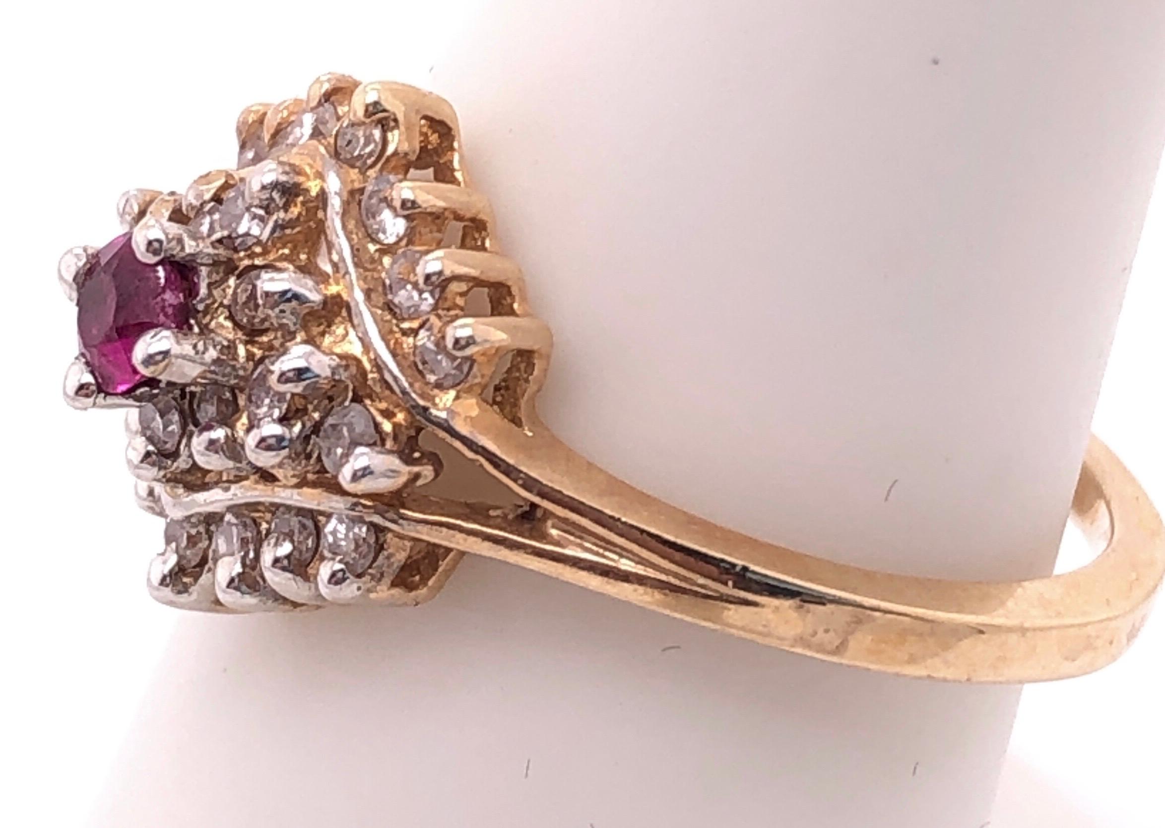 Round Cut 14 Karat Yellow Gold Ruby Solitaire with Diamond Cluster Ring