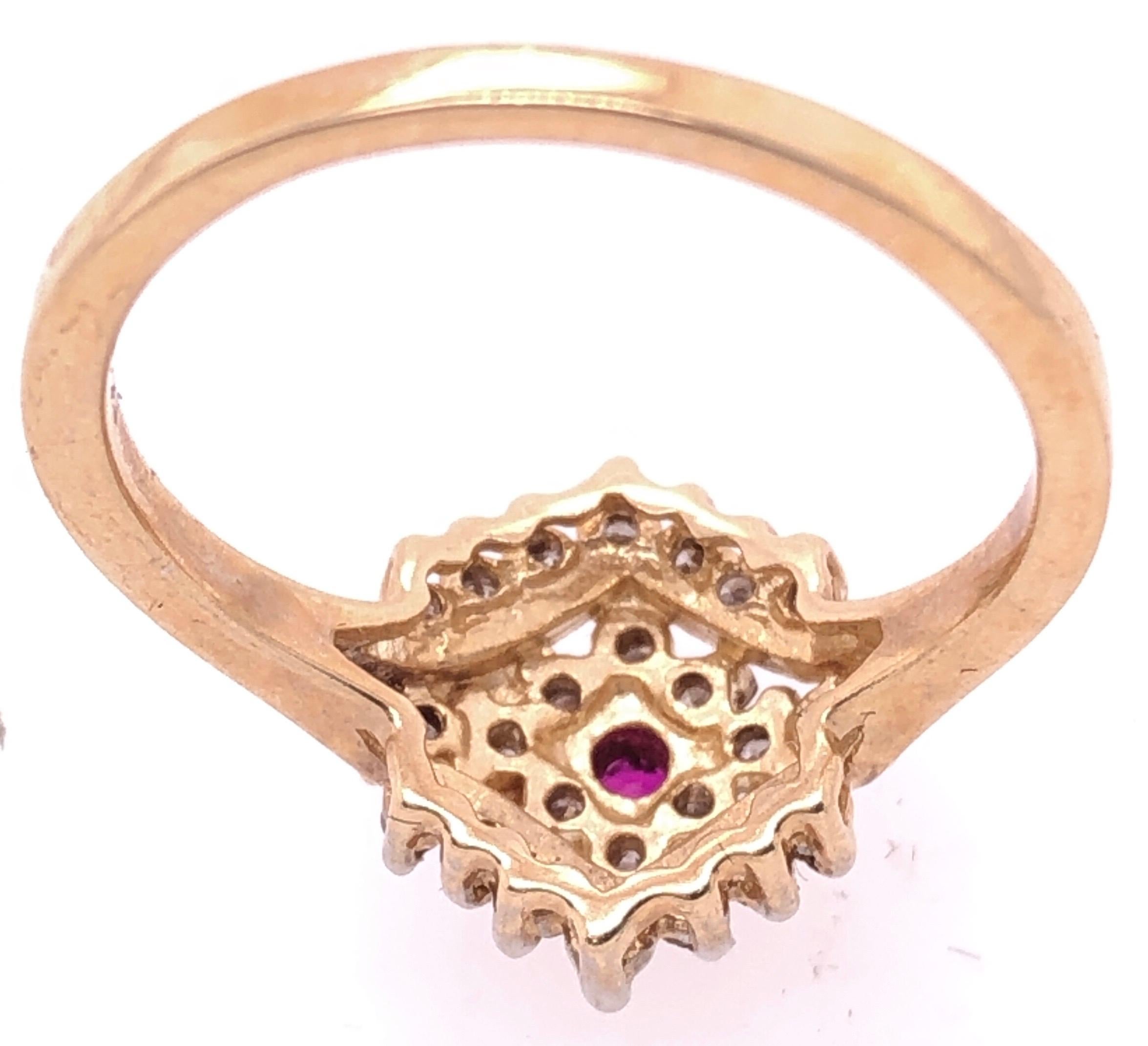 Women's 14 Karat Yellow Gold Ruby Solitaire with Diamond Cluster Ring