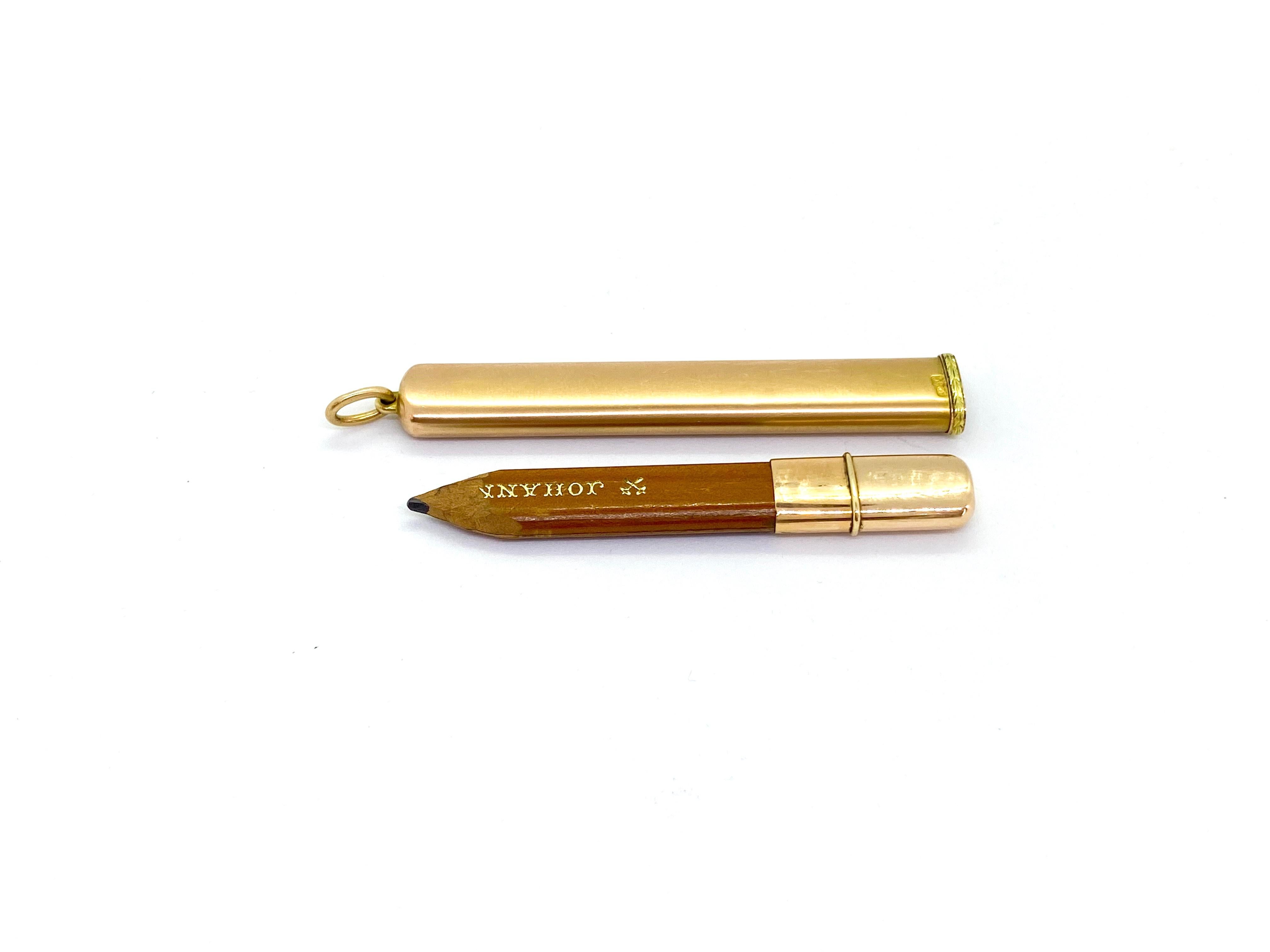 Pencil Holder Pendant
14 Karat Yellow Gold Russia Pencil Case Pendant.
14 Carat Yellow and Green Gold Russia Saint Petersburg 
Marked with 56 zolotnik old Russian gold standard 
Author's stamp unclear, see picture.
Faberge made similar pens, but I