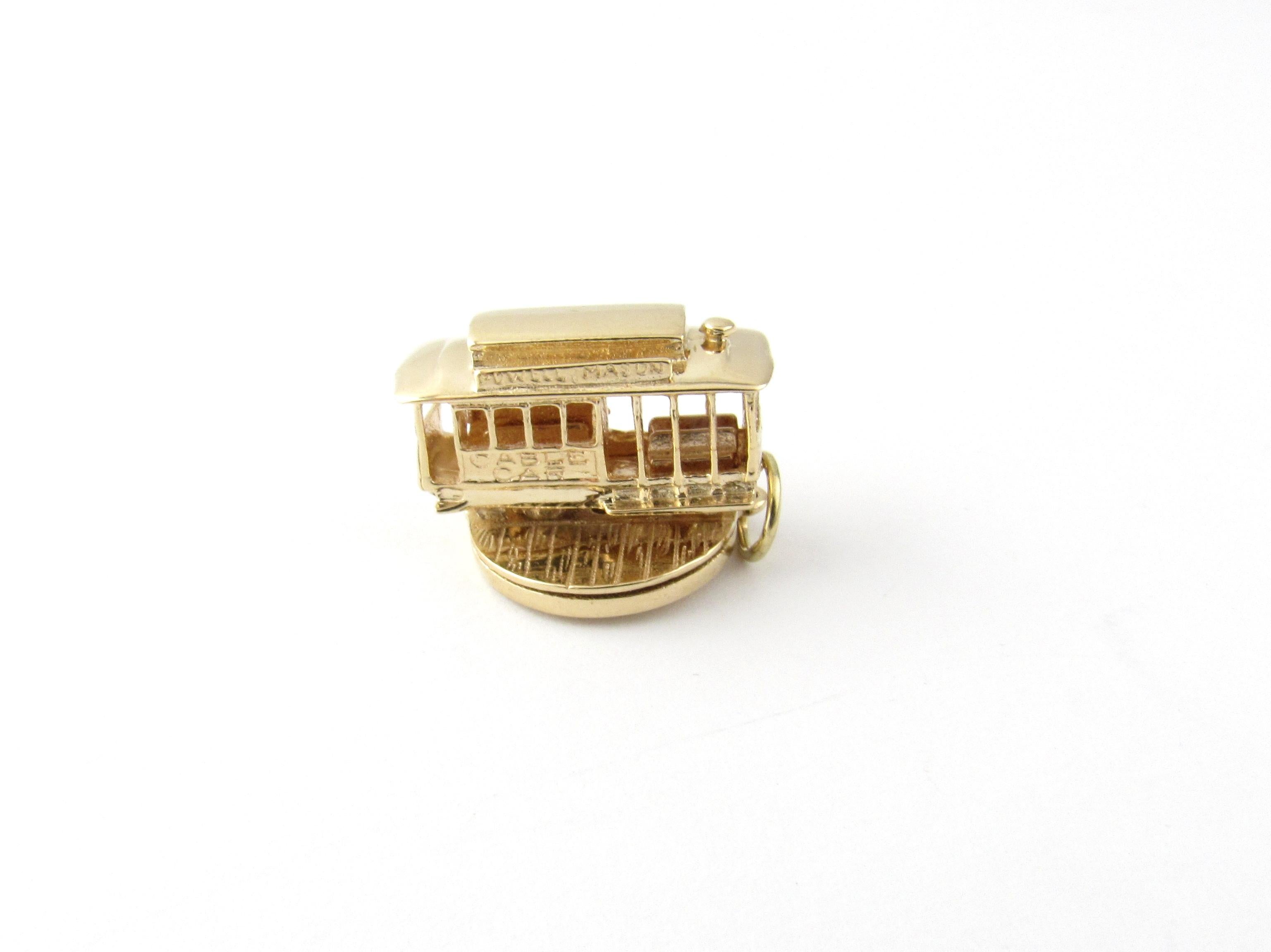 Vintage 14 Karat Yellow Gold San Francisco Cable Car Charm

Take a ride on the trolley!

This lovely 3D charm features a miniature cable car that spins on its round base. Bottom of charm reads 