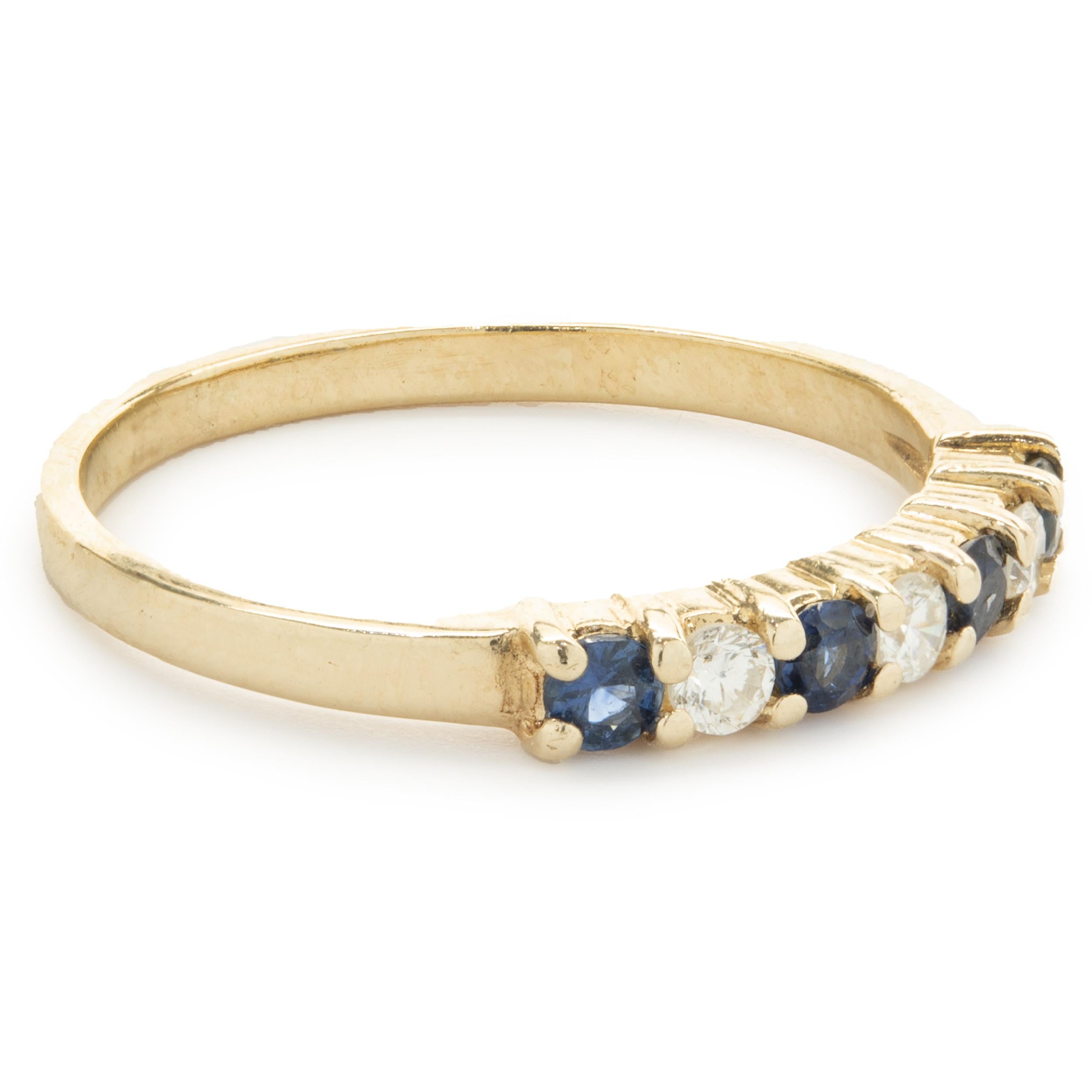 Designer: custom
Material: 14K yellow gold
Diamond: 3 round brilliant cut = .09cttw
Color: I
Clarity: SI1
Sapphire: 4 round cut = .17cttw
Dimensions: ring top measures 2.60mm
Ring Size: 5.5 (complimentary sizing available)
Weight: 1.52 grams