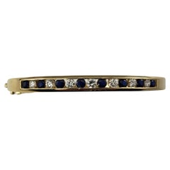 14 Karat Yellow Gold Sapphire and Diamond Bangle Bracelet