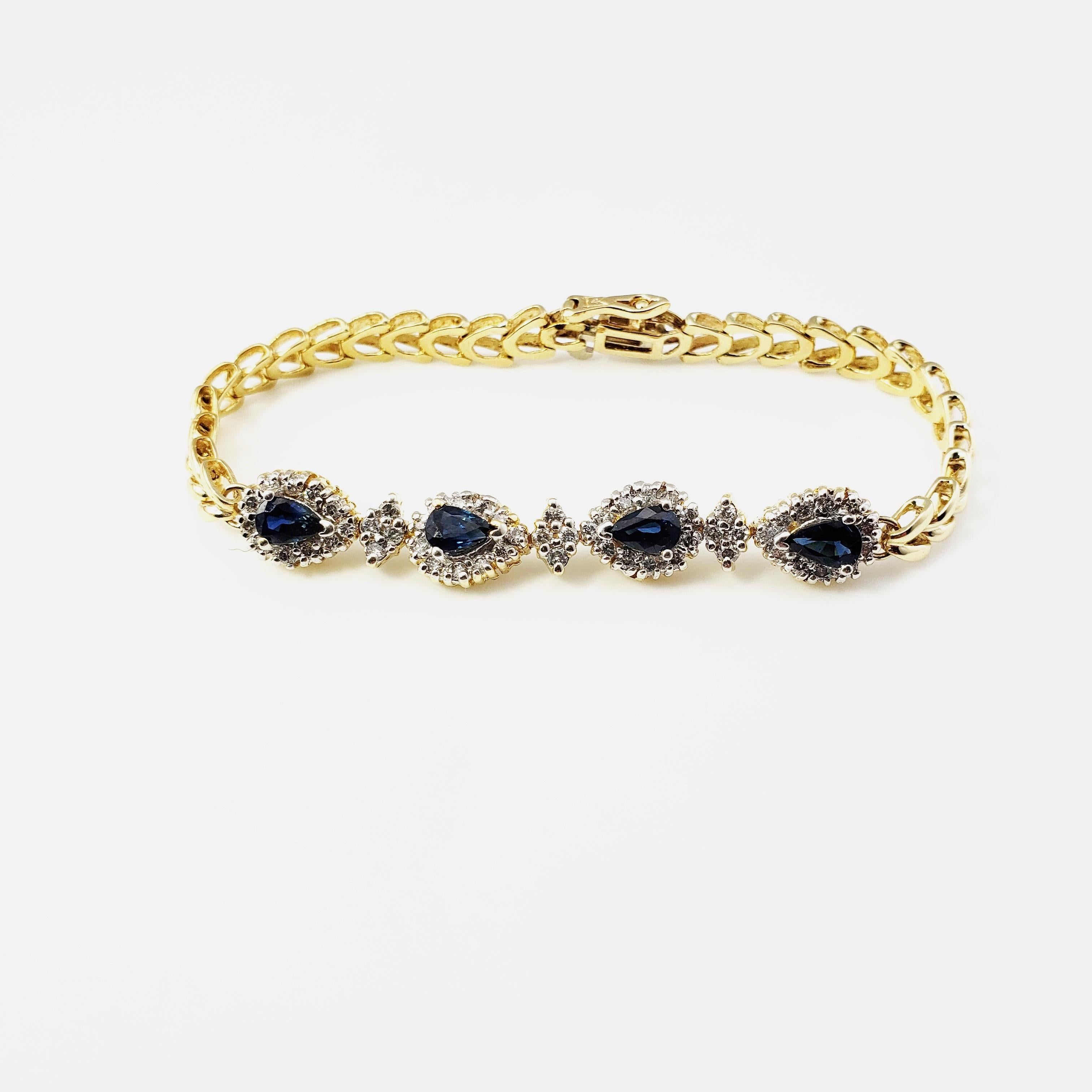 Vintage 14 Karat Yellow Gold Sapphire and Diamond Bracelet-

This lovely bracelet features four pear-shaped sapphires (7 mm x 5 mm each) and 56 round brilliant cut diamonds on a classic 14K yellow gold bracelet. Width: 8 mm. Safety