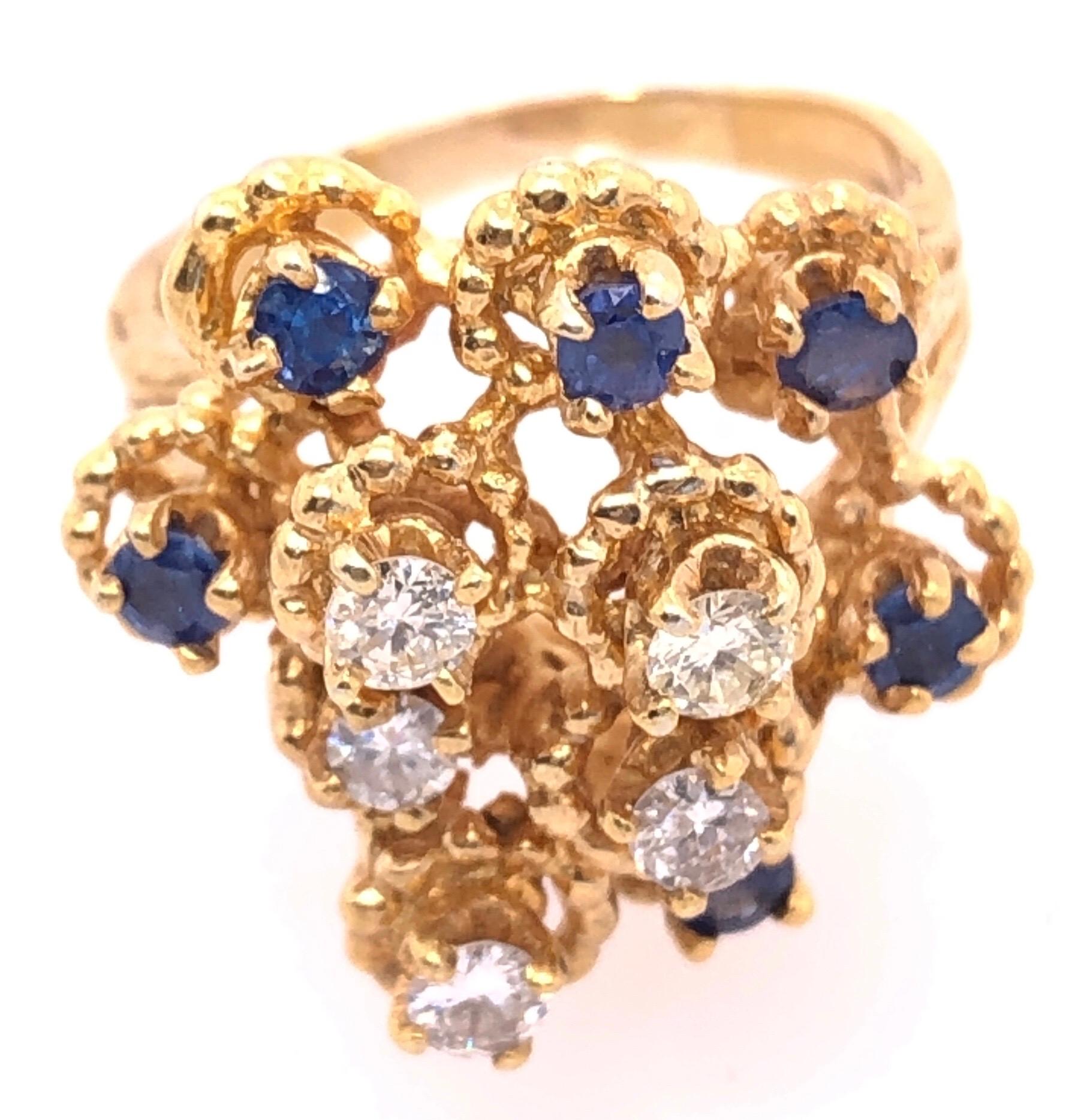 14 Karat Yellow Gold Sapphire And Diamond Cluster Ring Size 7.
1.00 total diamond weight
0.18 total sapphire weight
9.25 grams total ring weight
