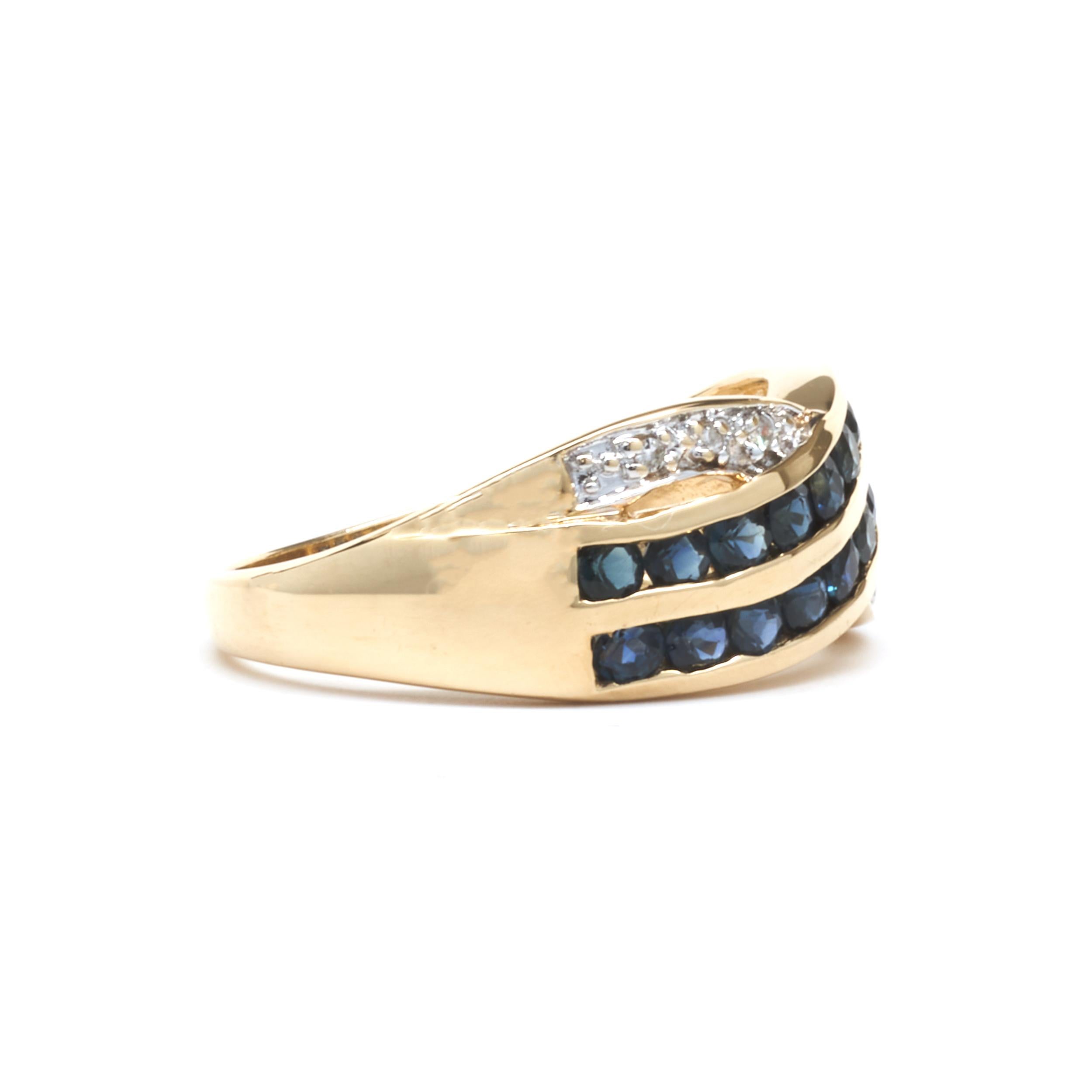 Designer: custom design
Material: 14K yellow gold
Diamond: 6 round cut = .06cttw
Color: H
Clarity: SI2
Sapphire: 20 round cut = 1.00cttw
Color: Blue
Clarity: A
Dimensions: ring top measures 9mm wide
Ring Size: 8.25 (please allow two extra shipping