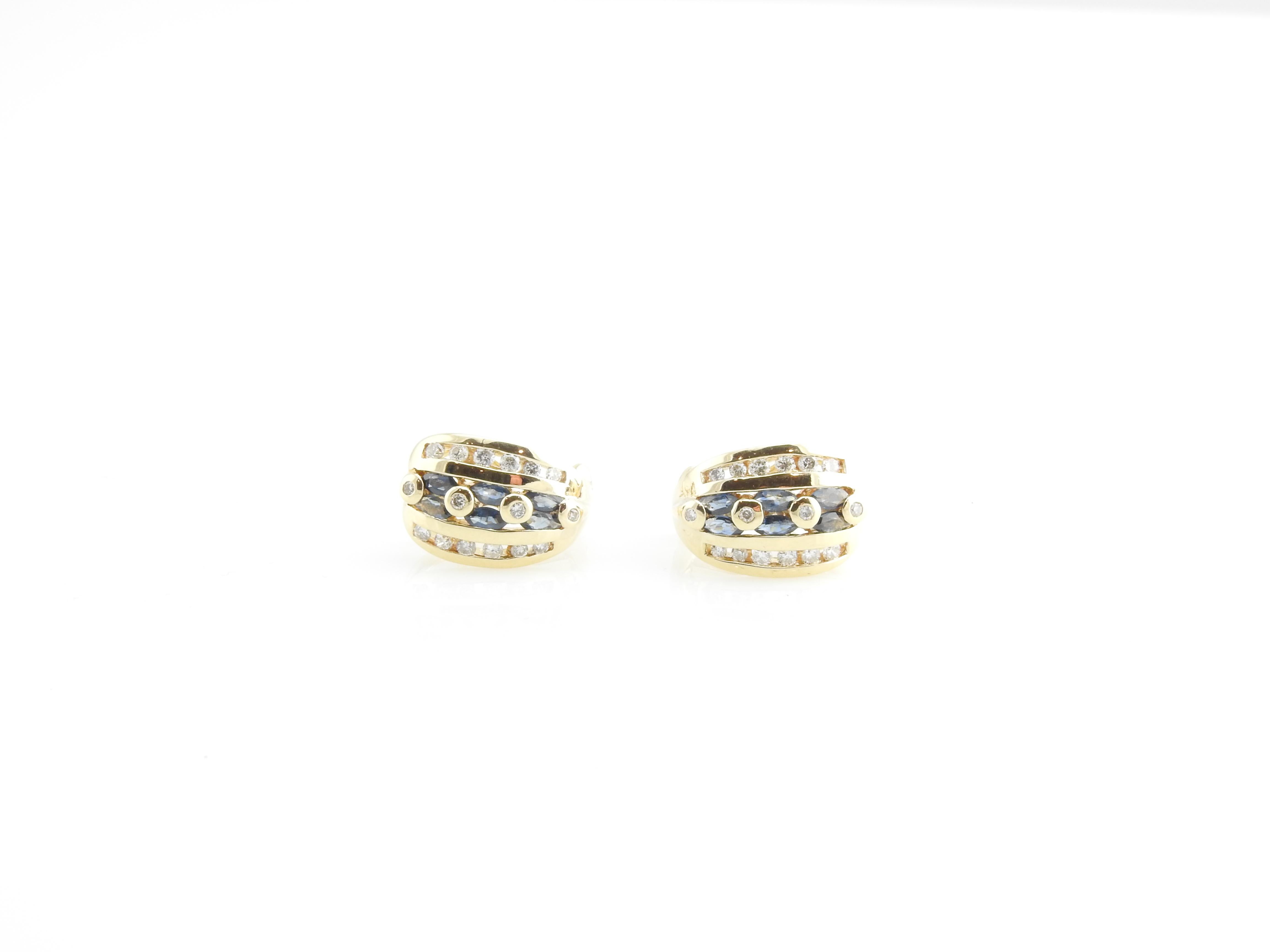 Vintage 14 Karat Yellow Gold Natural Sapphire and Diamond Earrings-

These lovely earrings each features three round natural sapphires and 16 round brilliant cut diamonds set in beautifully detailed 14K yellow gold.  Hinged closures.

Approximate