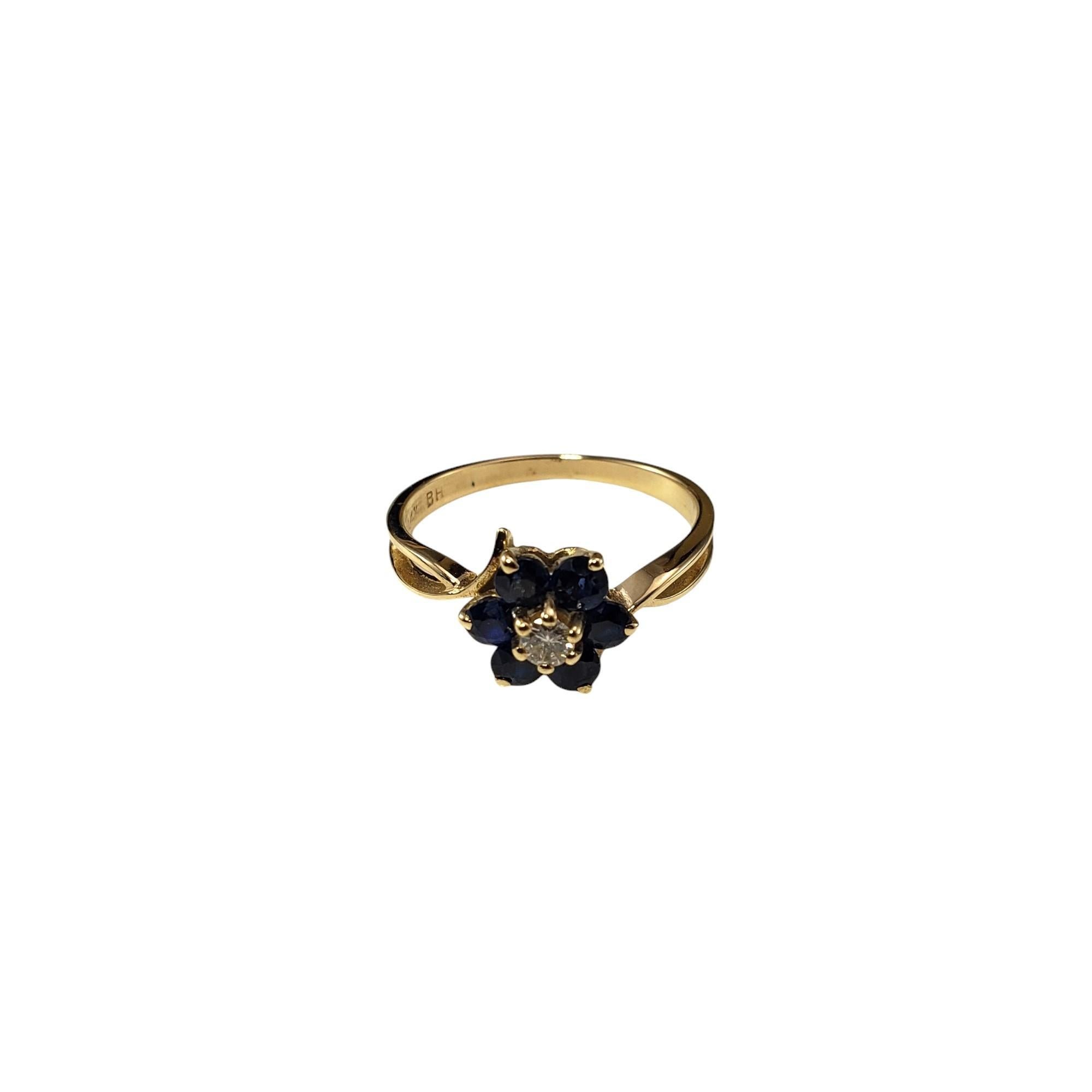 14 Karat Yellow Gold Sapphire and Diamond Ring Size 5.5-

This stunning 14K yellow gold ring features six round sapphires and one round brilliant cut diamond set in a lovely flower design.  Width: 9 mm. Shank: 1.5 mm.

Approximate total diamond