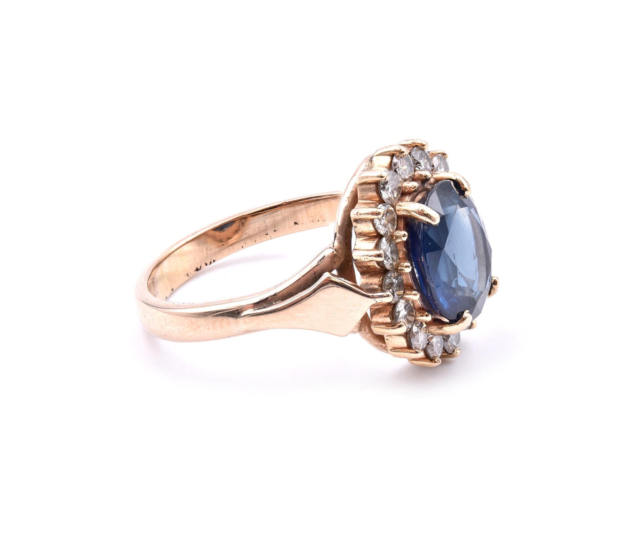 Designer: custom
Material: 14K yellow gold 
Sapphire: 1 oval cut = 2.80ct
Diamond: 16 round cut = .60cttw
Color: I
Clarity: VS2
Ring Size: 7.5 (please allow up to 2 additional business days for sizing requests)
Dimensions: ring shank measures