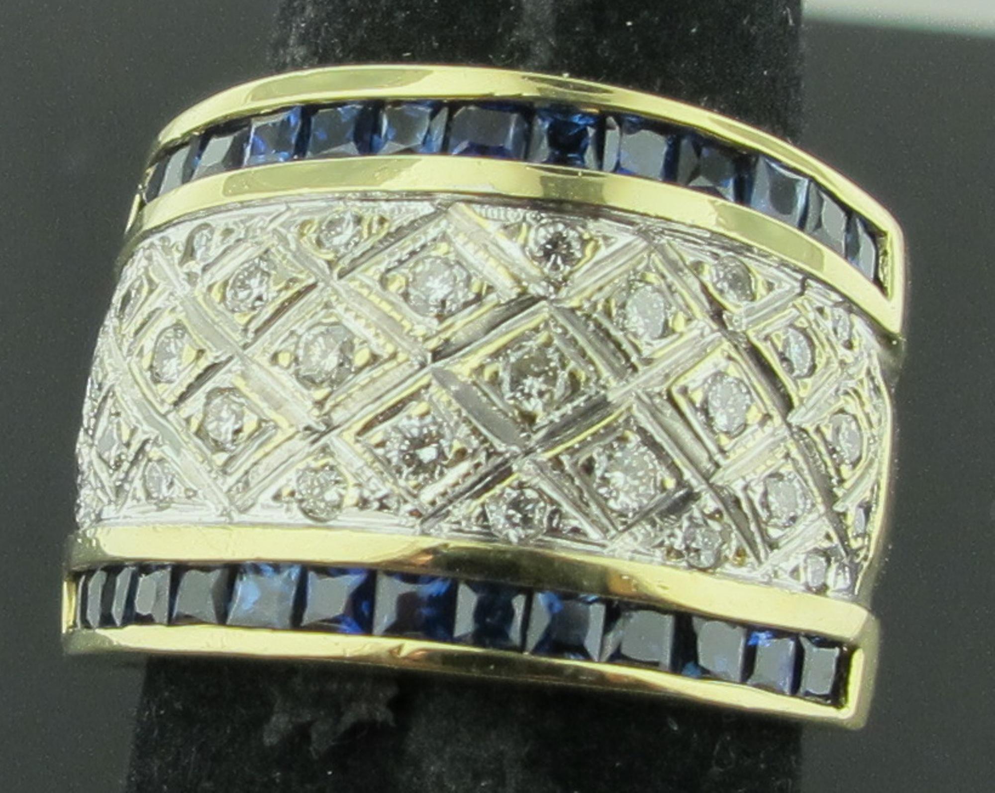 14 karat yellow gold ring with 28 square blue sapphires weighing approximately 1.33 carats and 32 round brilliant cut diamonds with a total weight of approximately 0.25 carats.  Ring Size is 7.