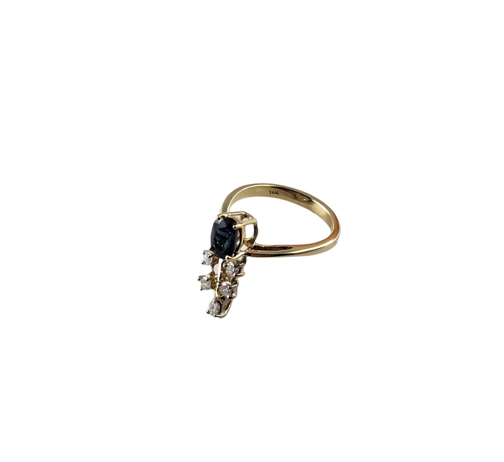Vintage 14 Karat Yellow Gold Sapphire and Diamond Ring Size 5-

This lovely ring features one oval sapphire (6 mm x 4 mm) and five round brilliant cut diamonds set in classic 14K yellow gold.
Width: 16 mm. Shank: 2 mm.

Approximate total diamond