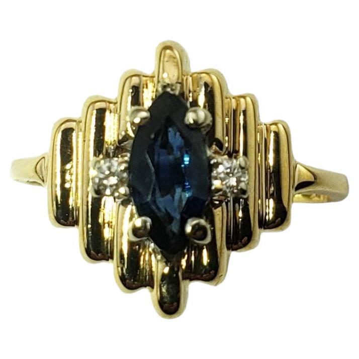 Anillo de oro amarillo de 14 quilates con zafiro natural y diamantes
