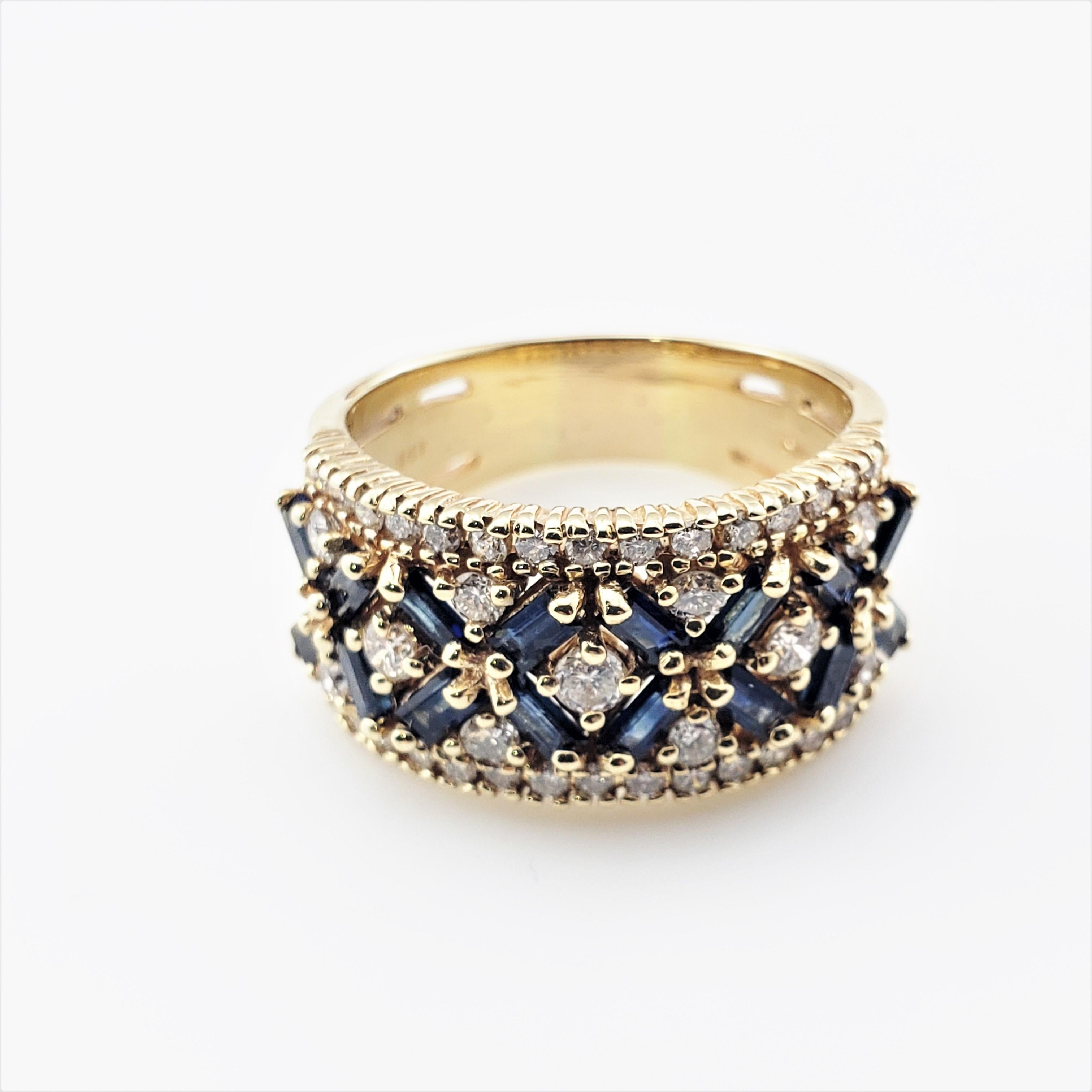 14 Karat Yellow Gold Sapphire and Diamond Ring Size 8.75 GAI Certified-

This  stunning band features 16 baguette sapphires and 41 round brilliant cut diamonds set in classic 14K yellow gold.  Width: 12 mm.

Sapphire weight:  .80 ct.

Clarity grade:
