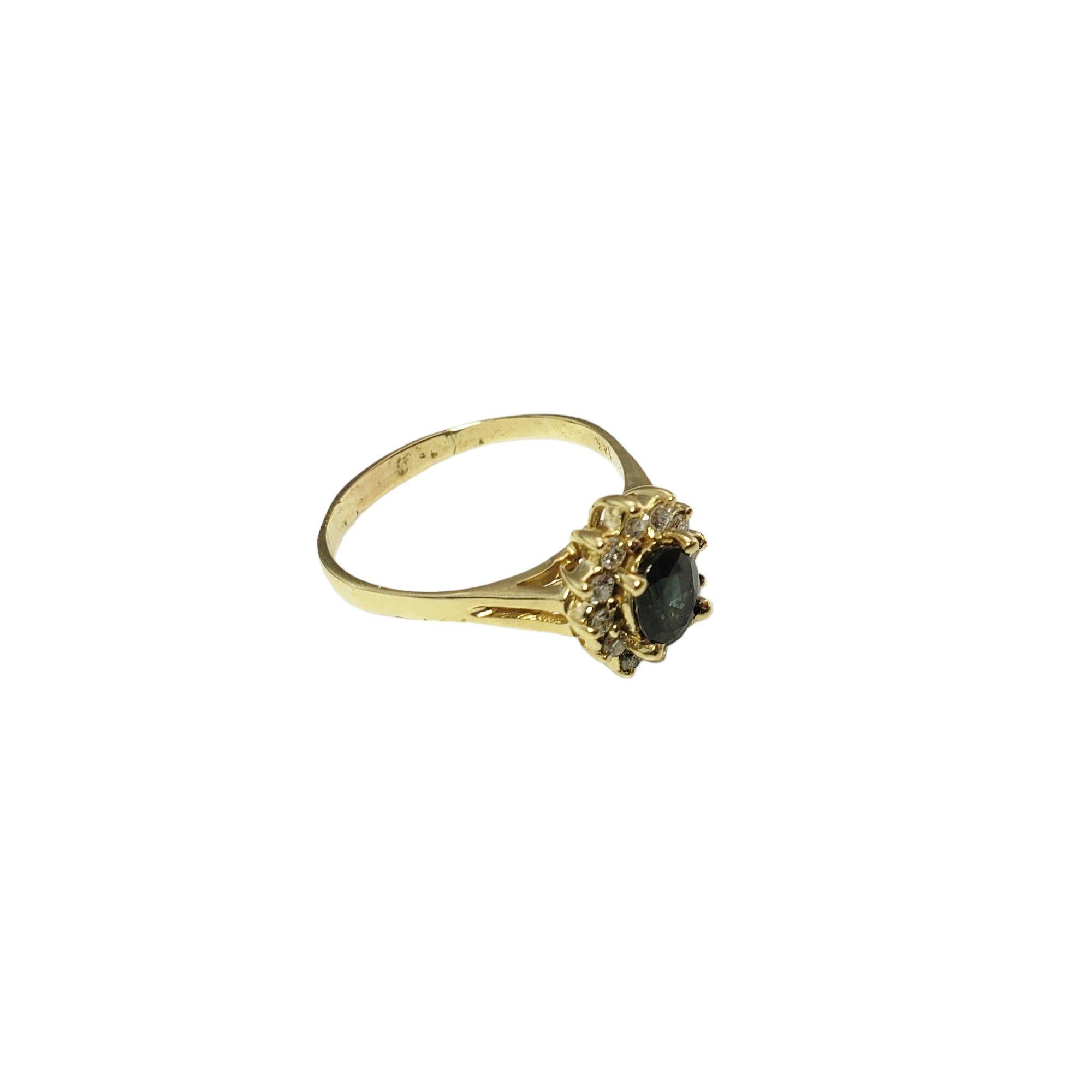 Vintage 14 Karat Yellow Gold Sapphire and Diamond Ring Size 9.5-

This lovely ring features one oval sapphire (7 mm x 5 mm) and 12 round brilliant cut diamonds set in classic 14K yellow gold.
Width: 12 mm. Shank: 2.5 mm.

Approximate total diamond