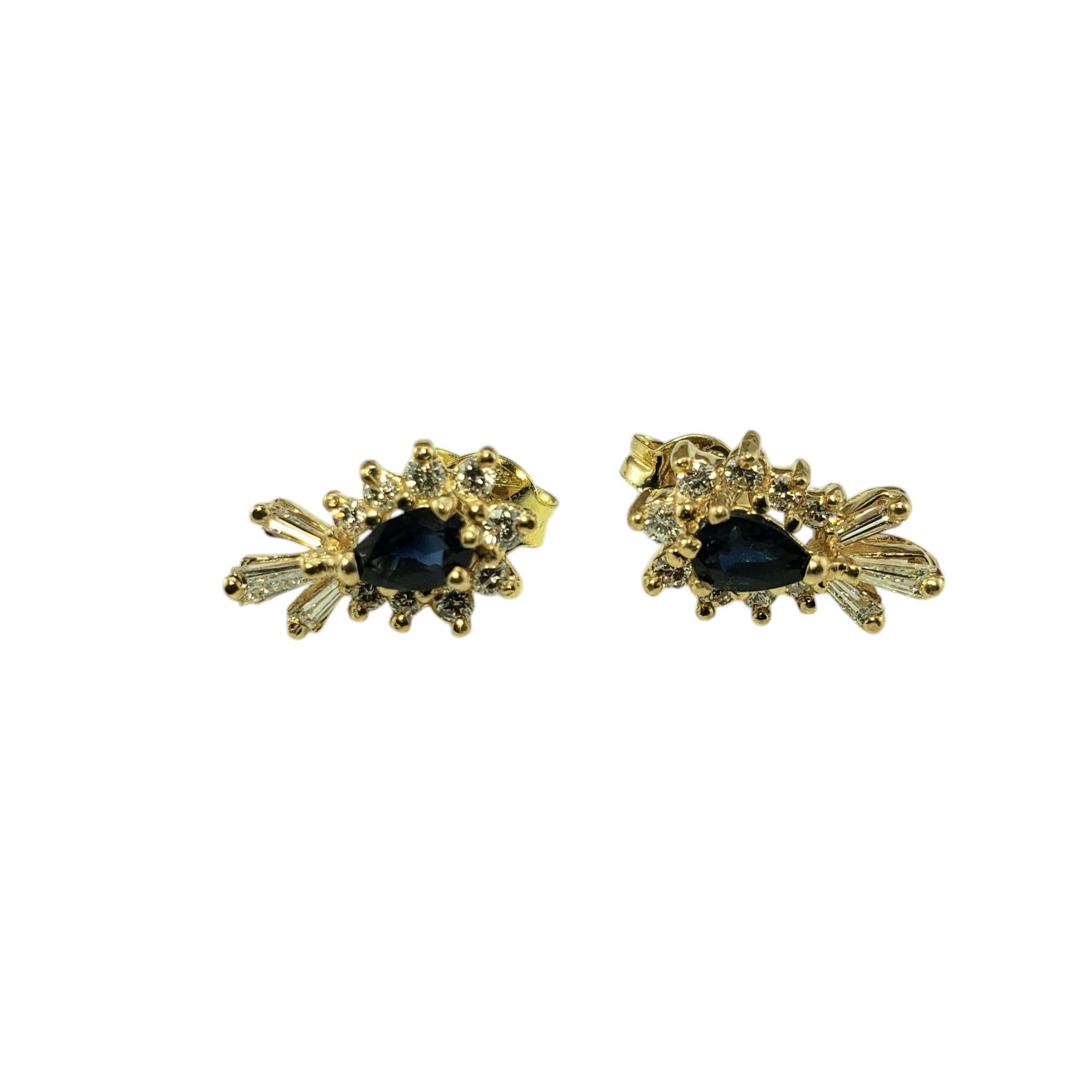 14 Karat Yellow Gold Sapphire and Diamond Stud Earrings JAGi Certified-

These lovely earrings each feature one pear cut natural blue sapphire (5 mm x 3.3 mm), three baguette diamonds and nine round brilliant cut diamonds set in 14K yellow gold.