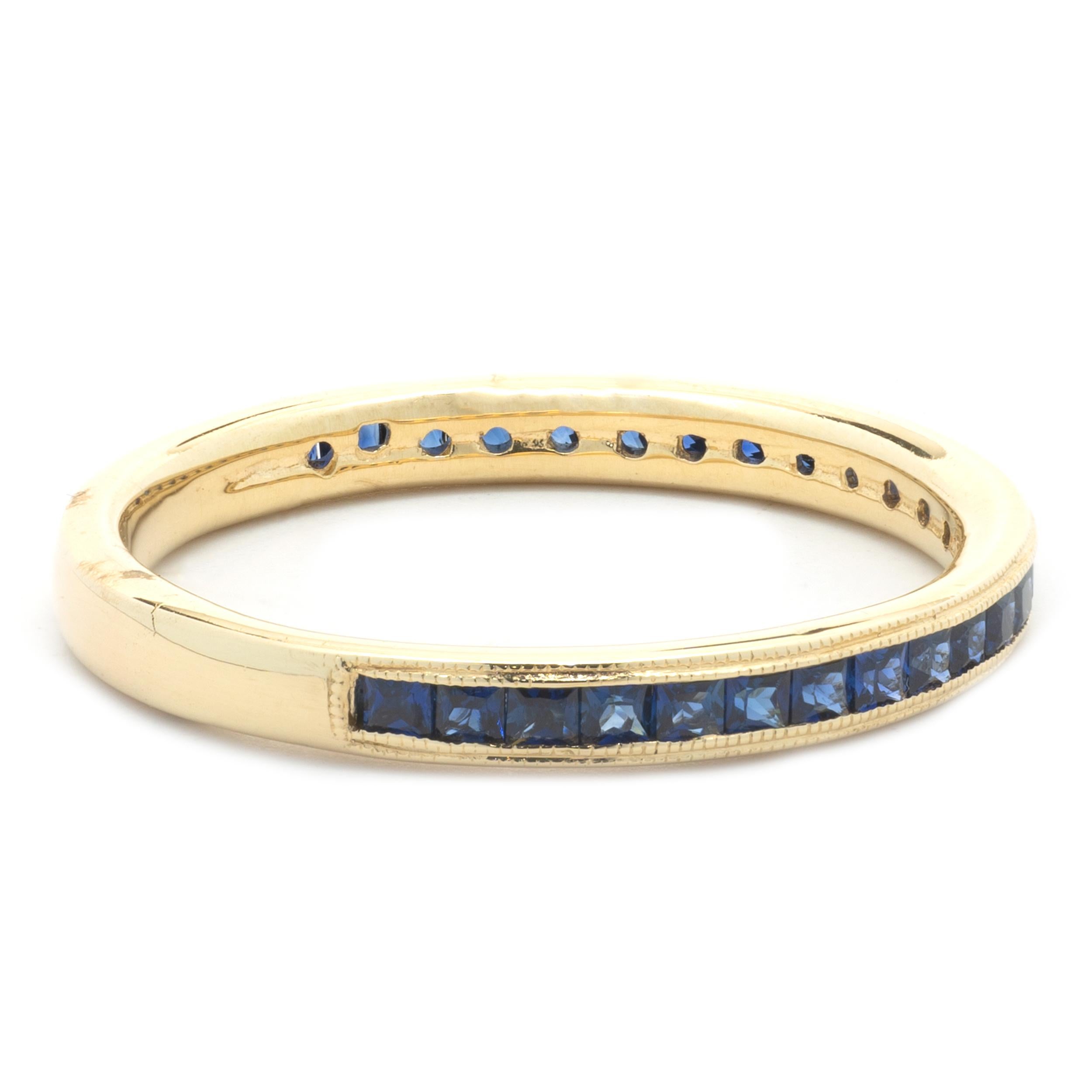 Designer: custom design
Material: 18K yellow gold
Sapphire: 27 princess cut = 1.00cttw
Color: Blue
Clarity: AAA, ideal deep royal blue
Dimensions: ring top measures 2.80mm wide
Ring Size: 10.25 (please allow two extra shipping days for sizing
