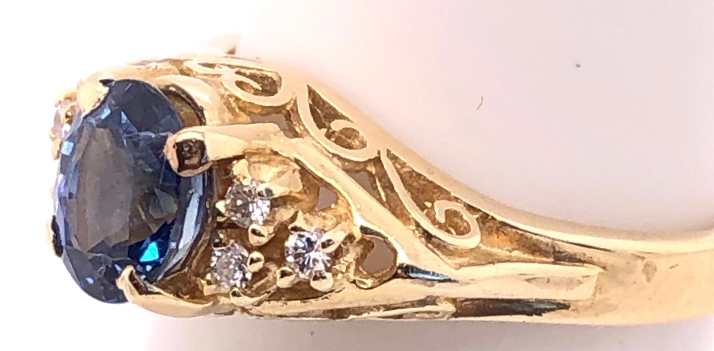 14 Karat Yellow Gold Sapphire Solitaire Ring with Side Diamond Accents Size 5
Lovely scroll work on ring.
0.06 total diamond weight.
Size 5
3 grams total weight.

*This ring can be resized at your local jeweler if need.