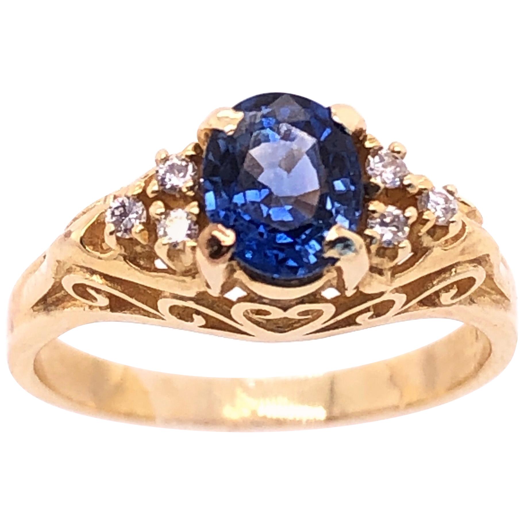 14 Karat Yellow Gold Sapphire Solitaire Ring with Side Diamond Accents For Sale