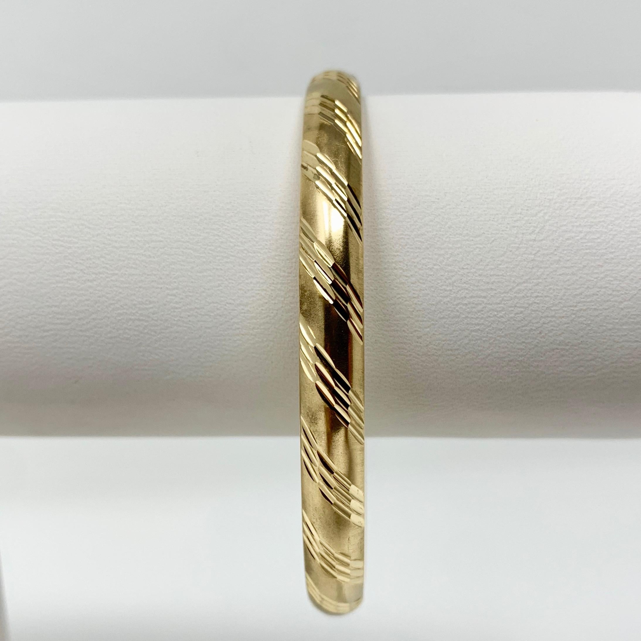14k Yellow Gold Satin Finish Etched Diamond Cut Bangle Bracelet 7 Inches

Condition:  Excellent Condition, Professionally Cleaned and Polished
Metal:  14k Gold (Marked, and Professionally Tested)
Weight:  8.7g
Length:  7 Inches 
Width:  6mm