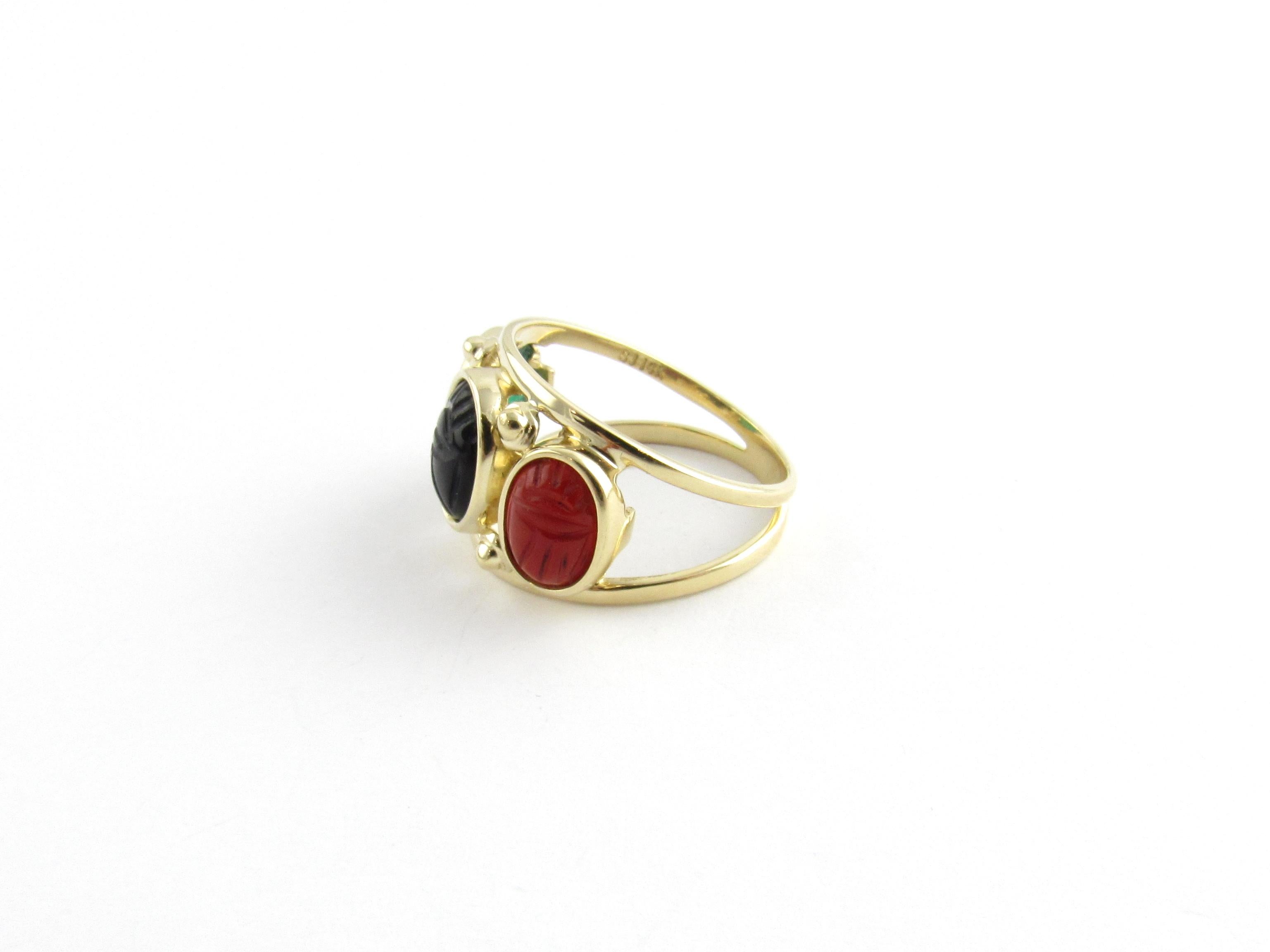 Vintage 14 Karat Yellow Gold Scarab Ring Size 6.5

This lovely ring features three oval scarabs (jade, onyx and carnelian) set in beautifully detailed 14K yellow gold. Stones measures 8 mm x 6 mm each. Ring width: 13 mm. Shank measures 3 mm.

Ring