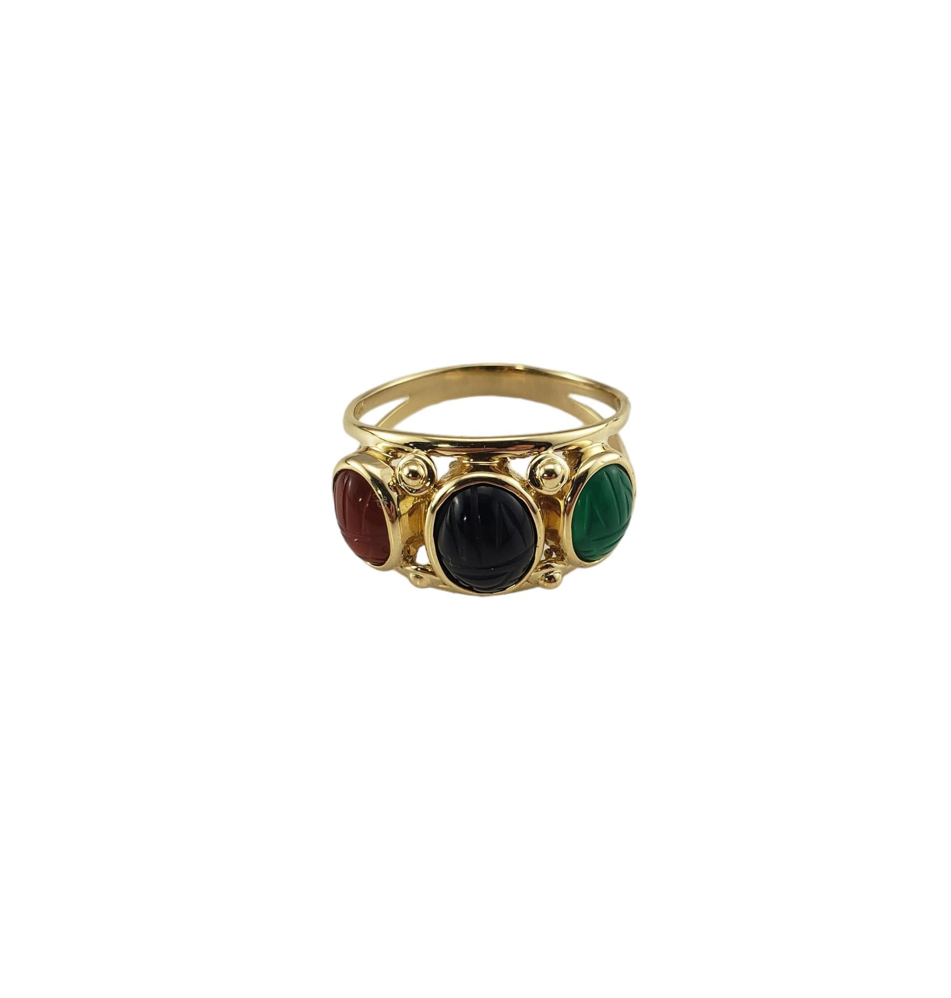 Vintage 14K Yellow Gold Scarab Ring Size 9.75-10

This elegant ring features three oval carved scarab design stones (carnelian, onyx, jade) set in beautifully detailed 14K yellow gold. 

 Width:  13 mm.  

Shank: 3 mm.

Ring Size: 9.75-10

Stamped: