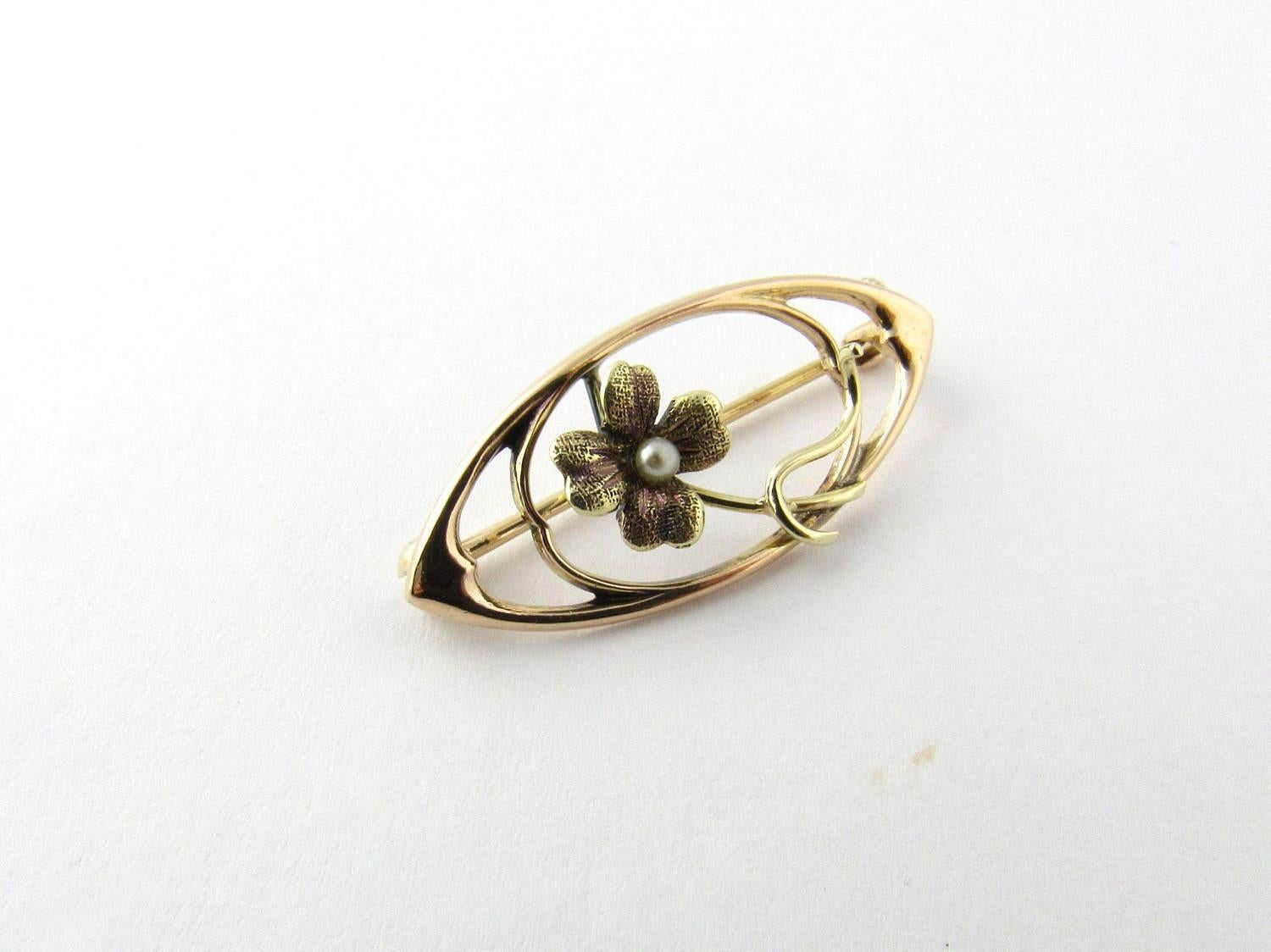 Vintage 14K Yellow Gold Seed Pearl Brooch. 

This brooch would would look simply beautiful as a dress or collar adornment. 

This brooch measures approx 10 mm x 6 mm x 24 mm. 

1.3 g / .8 dwt. 

1 seed pearl. 

This brooch is hallmarked 14K. 

This