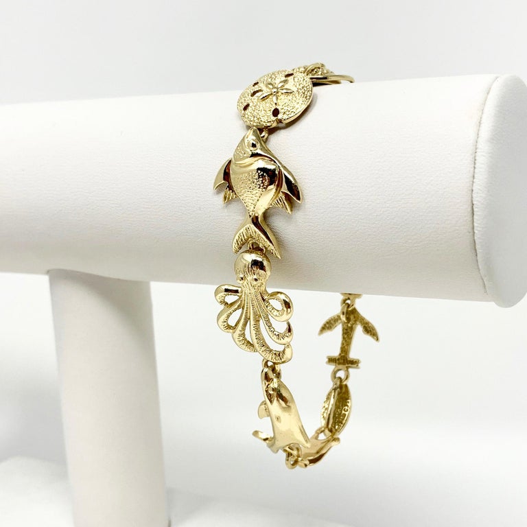 14 Karat Yellow Gold Shell Ocean Beach Charm Link Bracelet For Sale at 1stDibs