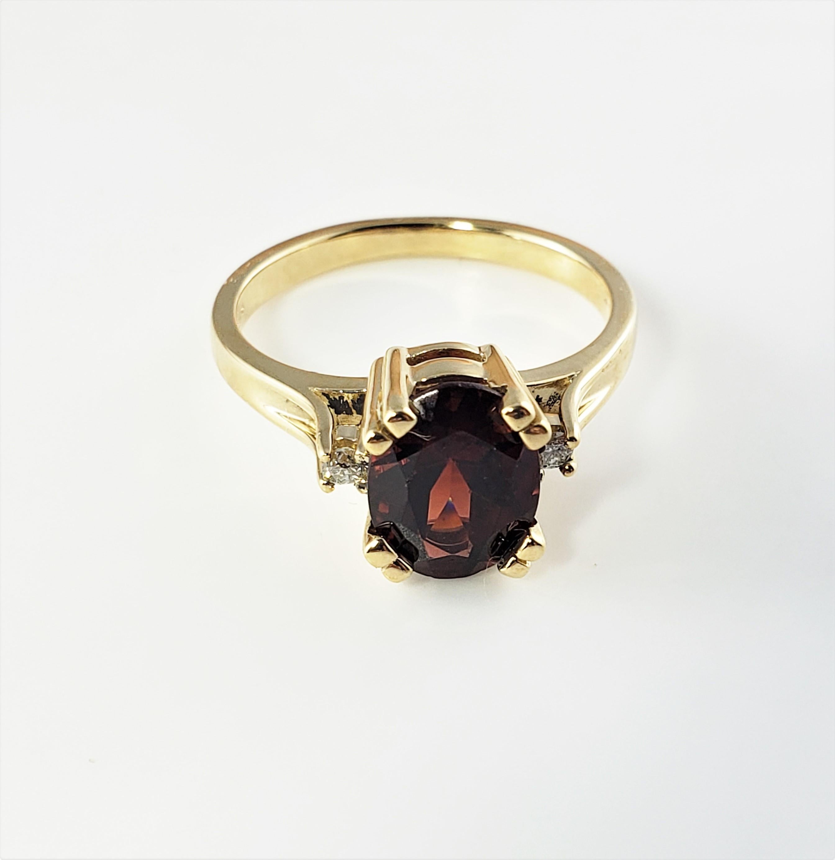 14 Karat Yellow Gold Simulated Garnet and Diamond Ring Size 6.5-

This lovely ring features one oval simulated garnet (9 mm x 7 mm) and two round brilliant cut diamonds set in classic 14K yellow gold.  Shank: 2 mm.

Approximate total diamond weight: