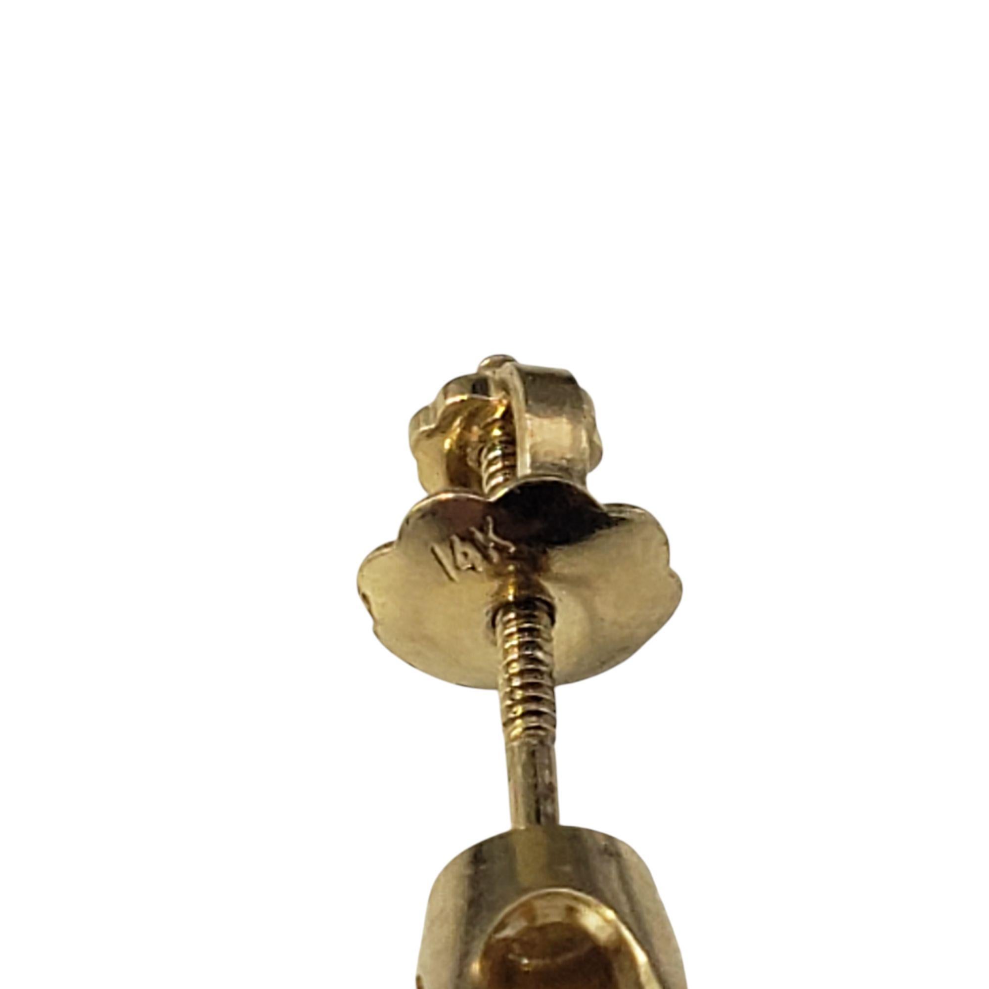 Clous d'oreilles en or jaune 14 carats avec un seul diamant #21417 en vente 1