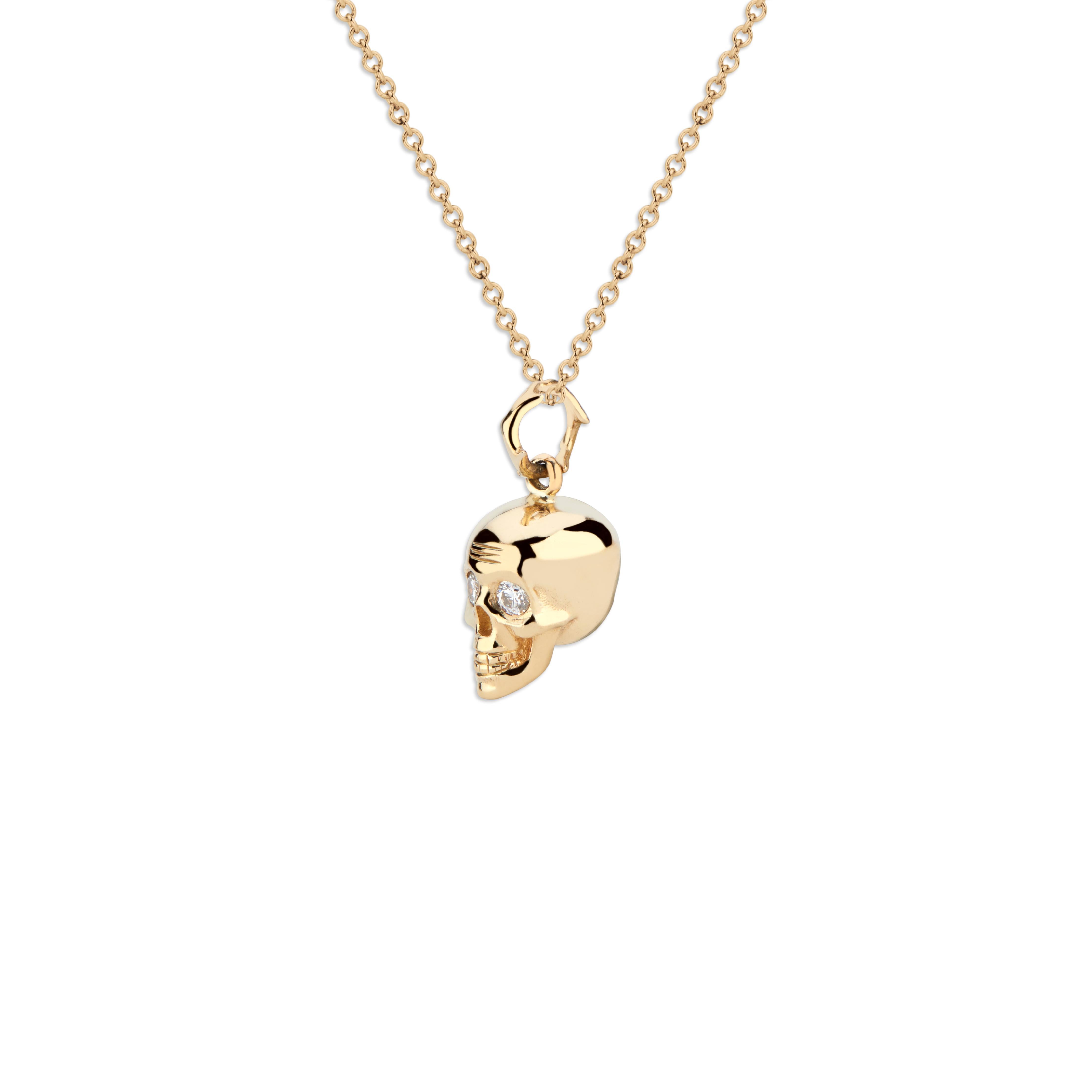 You can't go wrong with a skull, especially this one.  This 14k gold pendant is a hefty piece that is meant to make a statement.  It hangs on a Crown of Thorns jump ring, and the white diamond eyes command attention. Although the piece is fierce, it