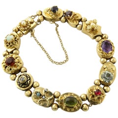Vintage 14 Karat Yellow Gold Slide Charm Bracelet with Multiple Gemstones and Diamonds