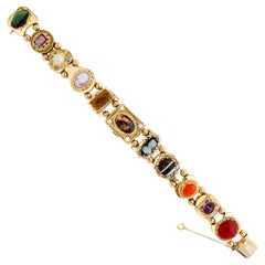 14 Karat Yellow Gold Slide Charm Multi Stone Filigree Bracelet with Hidden Watch