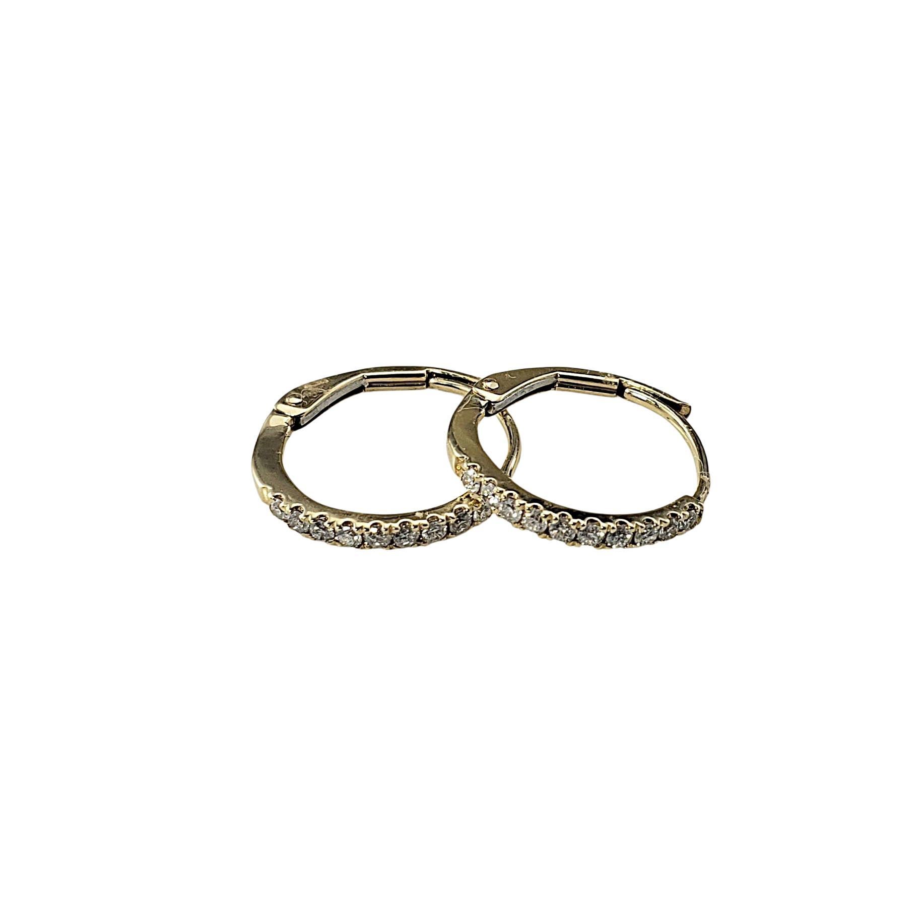 14 Karat Yellow Gold and Diamond Hoop Earrings

Timeless and elegant these 14K yellow gold hoop earrings are each adorned with 10 round brilliant cut diamonds, delivering just the right amount of sparkle.

Approximate total diamond weight: .20