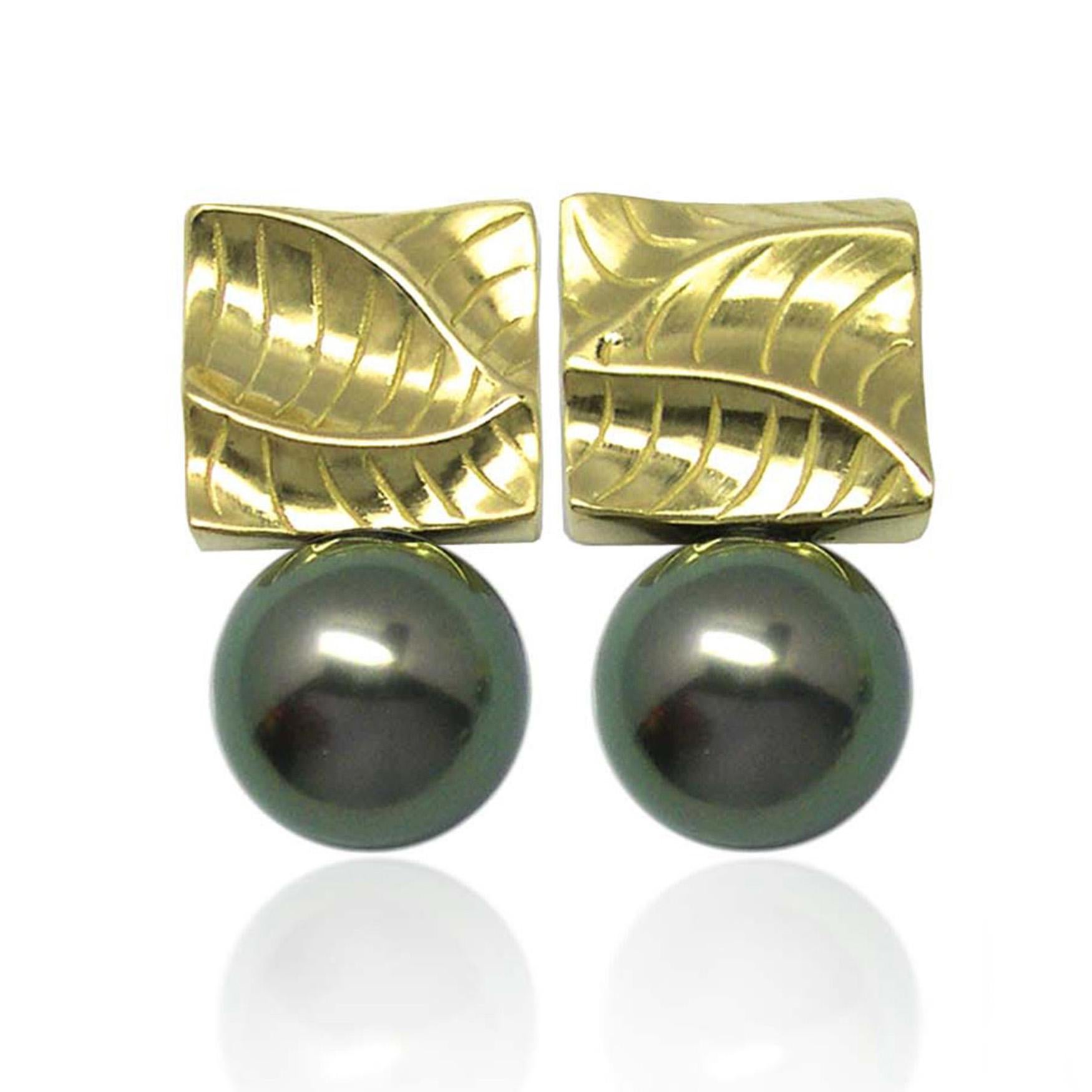 Keiko Mita’s Small Square Pearl Earrings are handmade from 14 Karat Yellow Gold. The contemporary earrings, which are 18 mm long and 10 mm wide, feature 8.5 mm Tahitian Pearls and the artist’s signature Dune texture. These unique earrings from her
