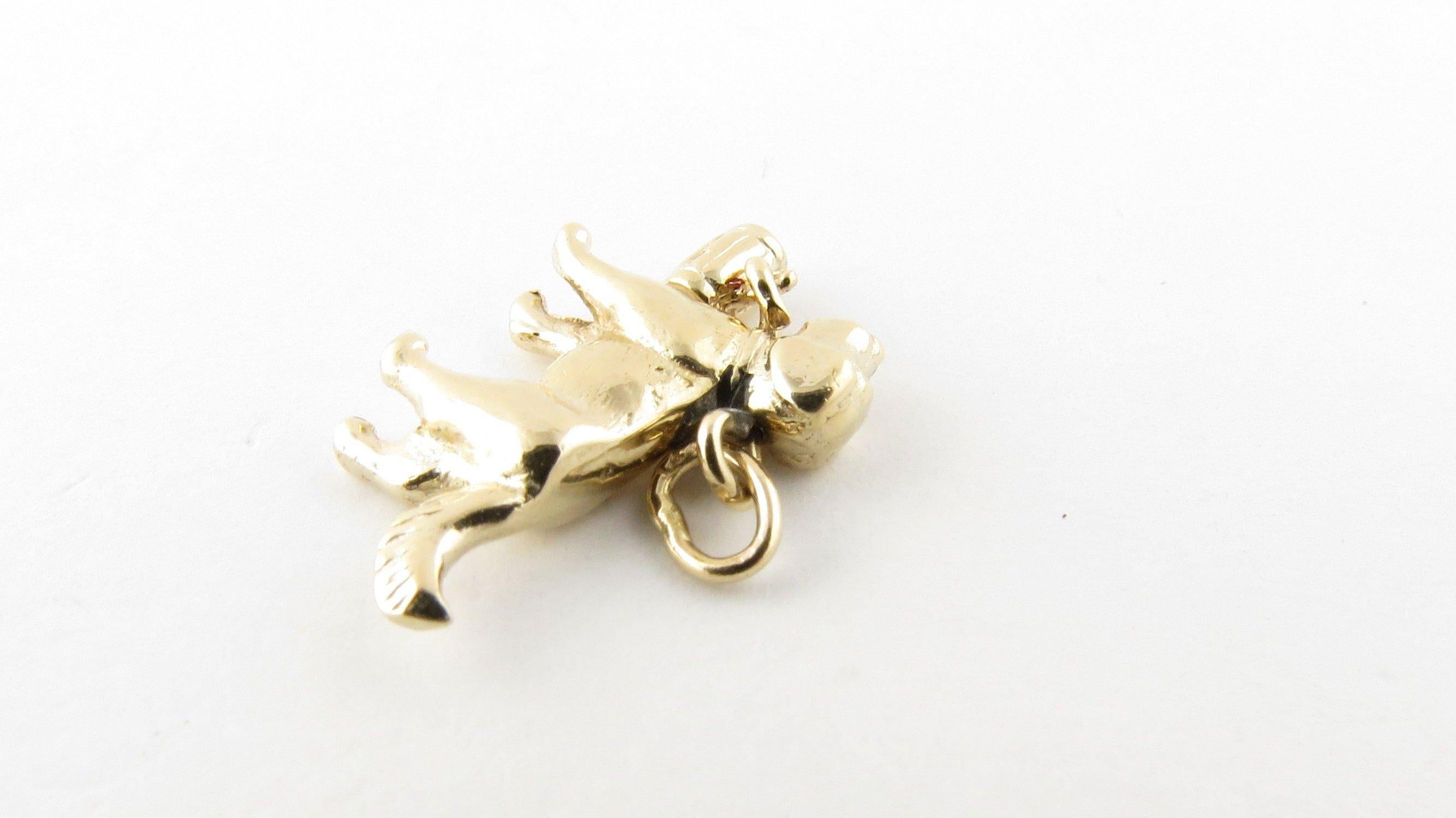 Vintage 14 Karat Yellow Gold St. Bernard Dog Charm- This lovely 3D charm features a miniature St. Bernard complete with dangling keg around his neck! Size: 14 mm x 17 mm (actual charm) Weight: 1.6 dwt. / 2.6 gr. Stamped: 14K Very good condition,