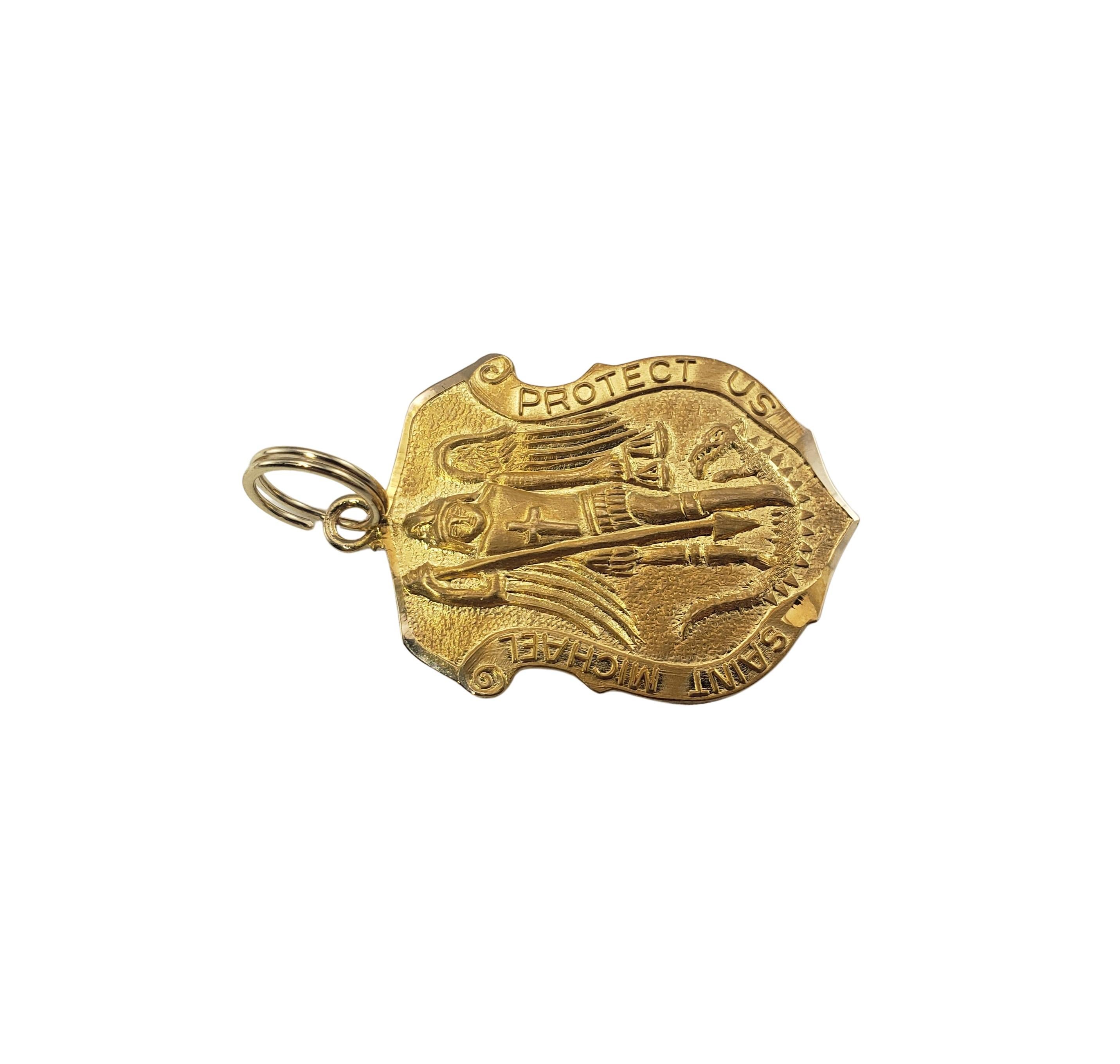 14 Karat Yellow Gold St. Michael Pendant-

This elegant pendant features St. Michael, the patron saint of police, military and firemen, crafted in beautifully detailed 14K yellow gold.

Size: 30 mm x 21 mm

Weight:    3.7 dwt. /   5.8 gr.

Stamped: 
