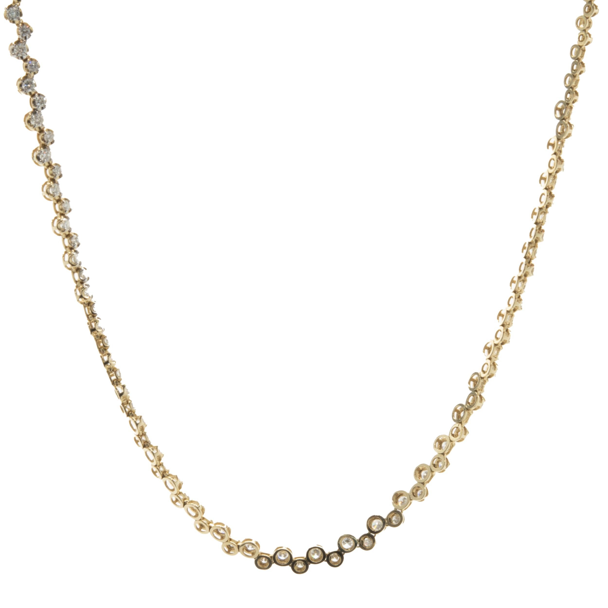 Designer : custom	
Matériau : or jaune 14K
Diamants : 69 diamants ronds de taille brillant = 3,00cttw
Couleur : H
Clarté : SI1
Dimensions : le collier mesure 18 pouces de long 
Poids : 17,94 grammes