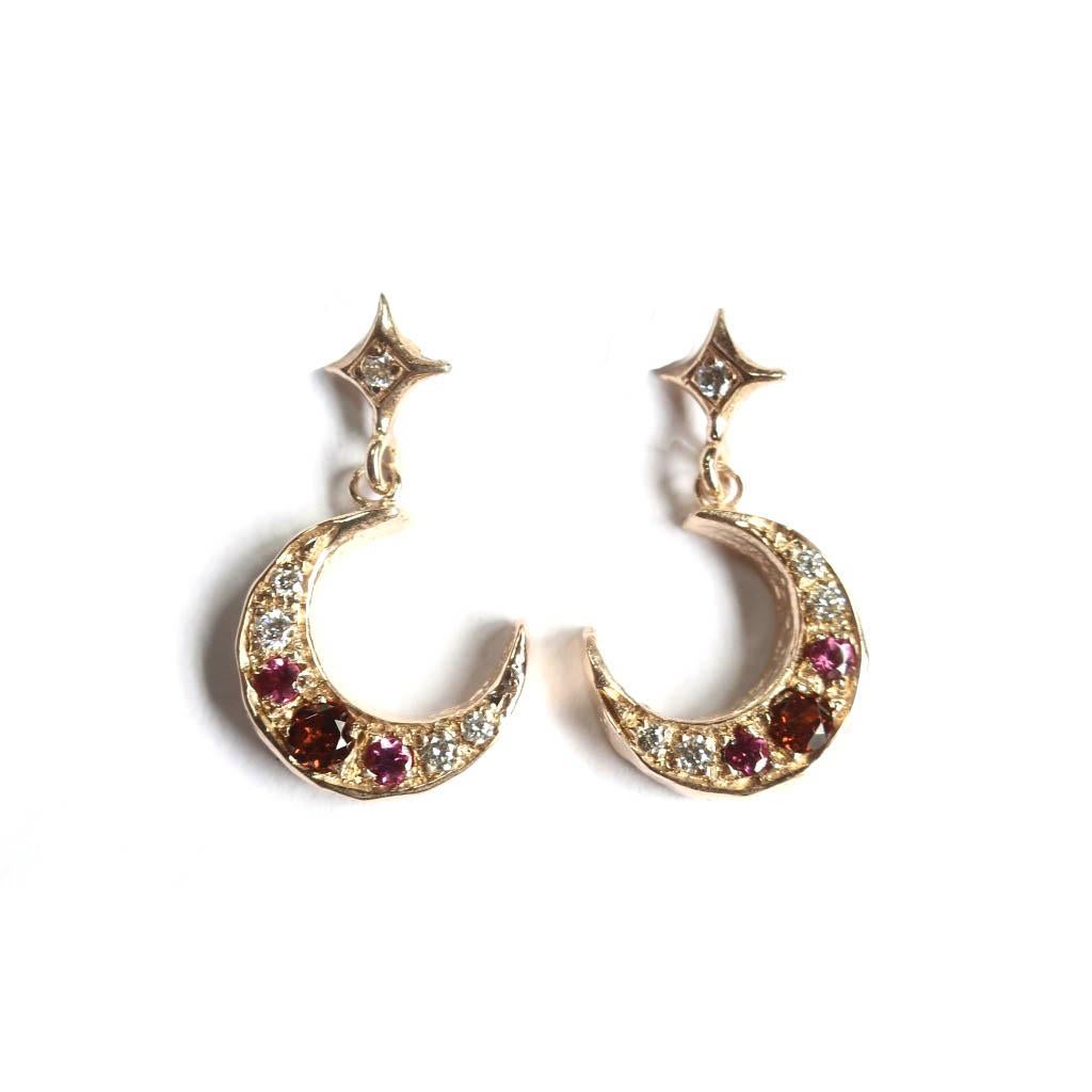 Romantic Art Nouveau inspired crescent moon earring set with red and pink garnets and diamond pave. These post earrings are delicate with the moon diameter about 11mm.  A red 3mm garnet is bead set with two 2.25mm rhodolite garnets and white vs