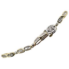 Bracelet tennis station en or jaune 14 carats avec 67 pièces de diamants taille ronde