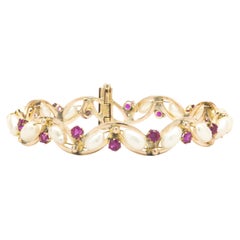 14 Karat Yellow Gold & Sterling Silver Vintage Pearl and Ruby Bangle Bracelet