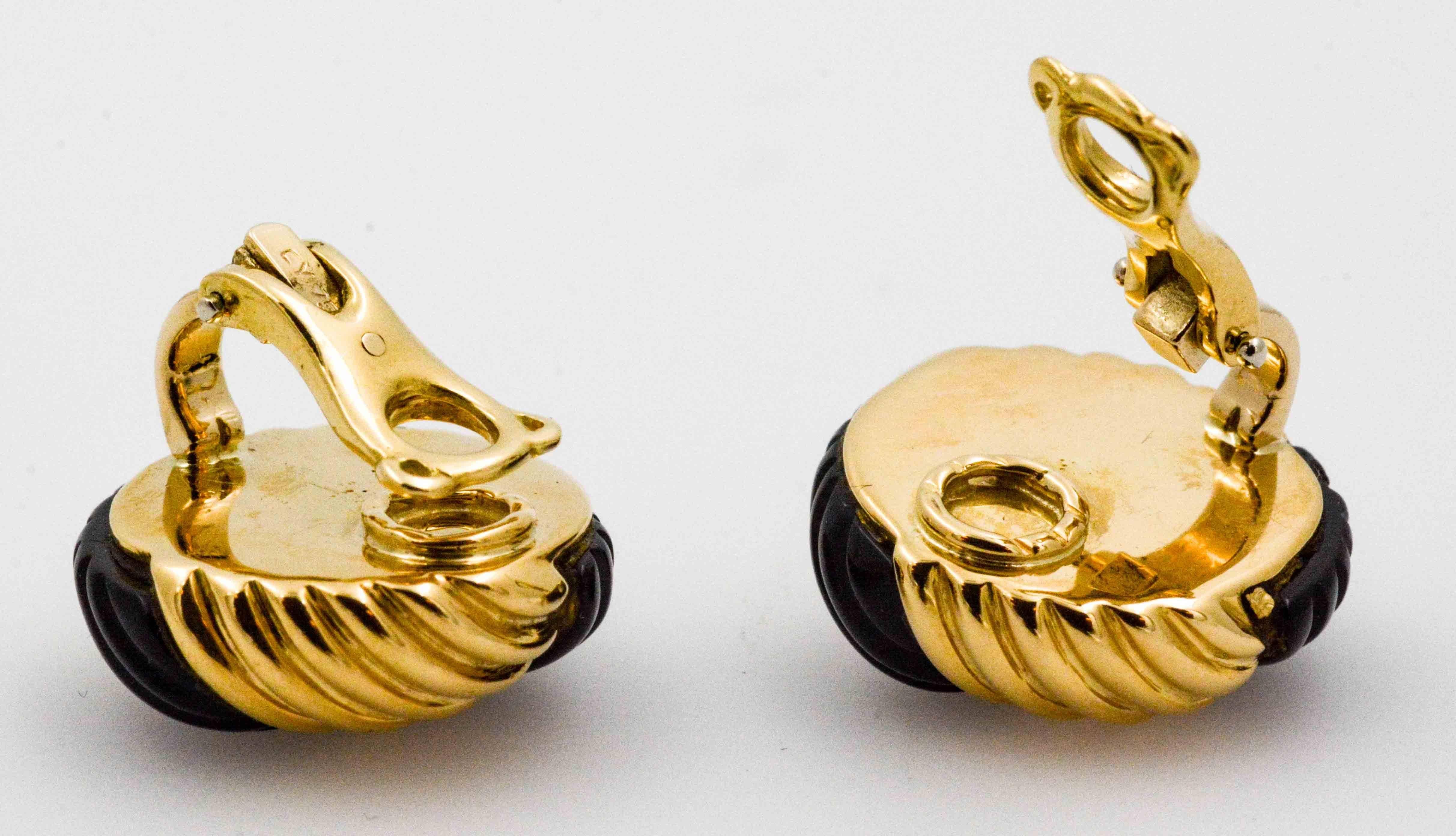 There's a new pattern on the horizon in these swirling black onyx and 14 karat yellow gold clip on earrings. This pair of lightweight and stylish earrings are fabulous for day or evening, and have passed the our standard of quality.