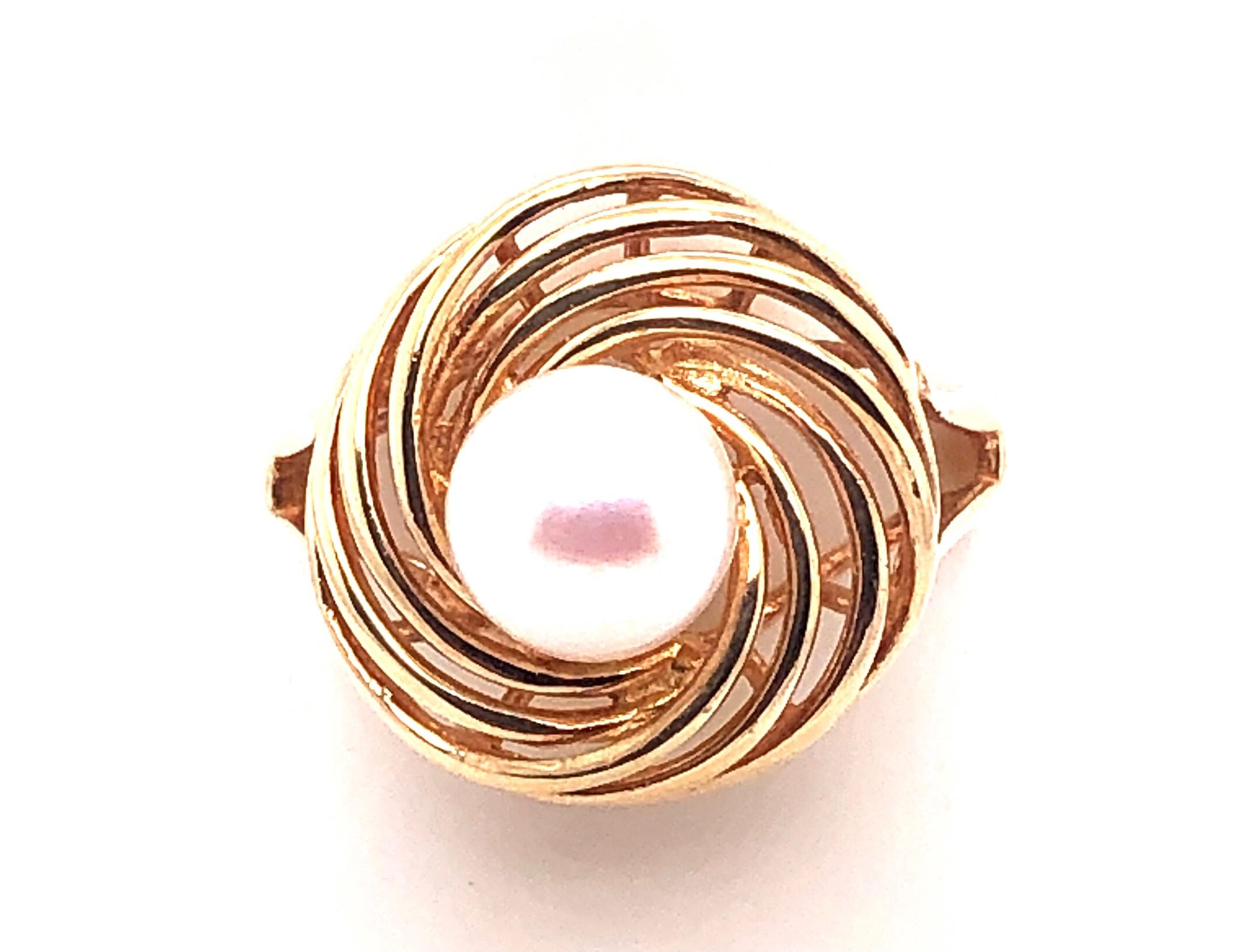 14 Karat Yellow Gold Swirl Pearl Ring.
Size 7
3.5 grams total weight.
16mm ring swirl diameter
6.73 mm pearl size
Stamped 14K 585