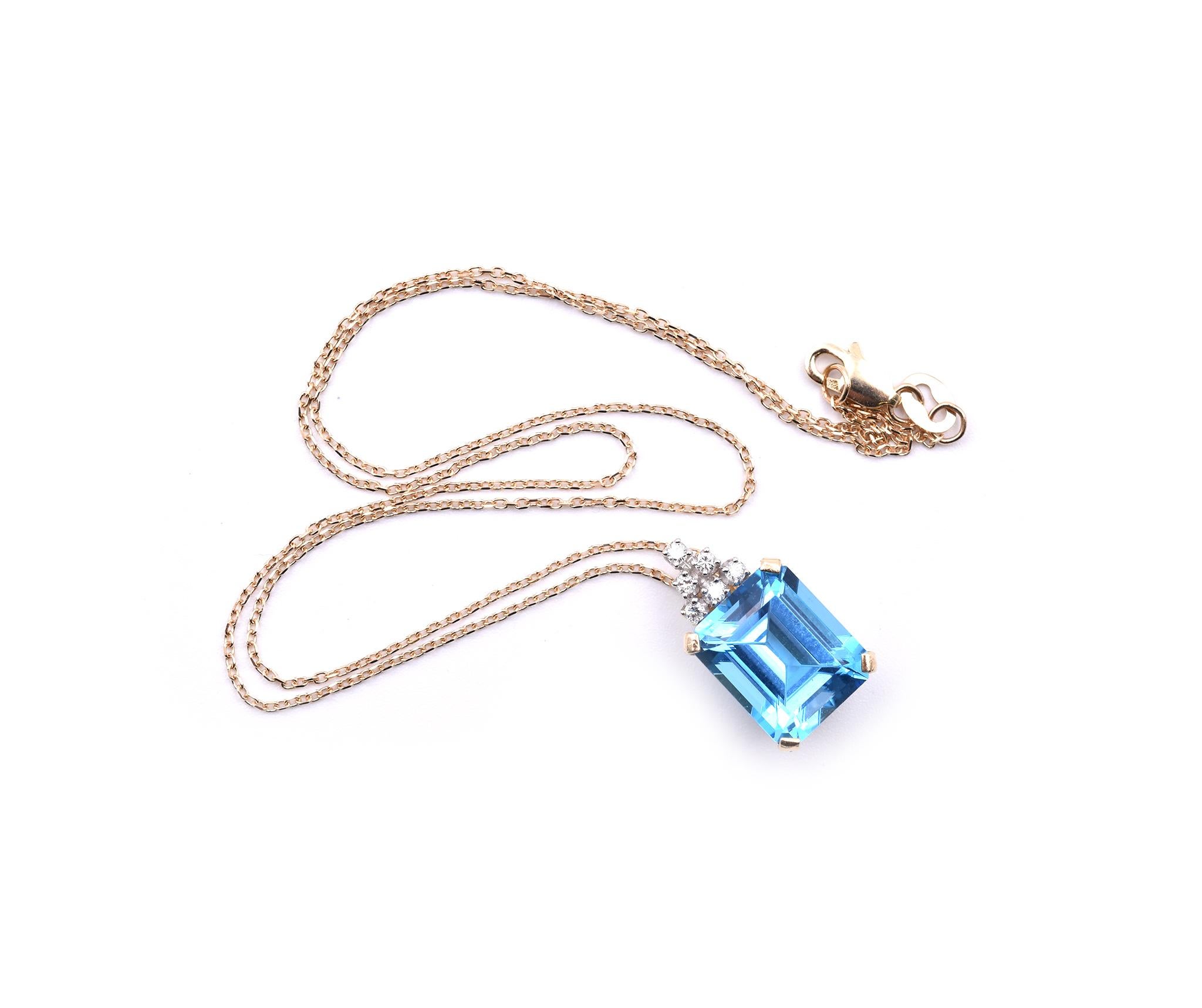 Designer: custom
Material: 14K yellow gold
Blue Topaz: 1 emerald cut = 7.88ct
Color: Swiss Blue
Diamonds: 6 round cut = .18cttw
Color: G 
Clarity: VS
Dimensions: the pendant measures 17.9mm x 10.6mm 
Weight: 2.81 grams