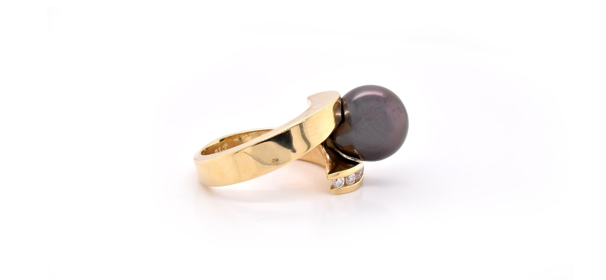 Material: 14k yellow gold
Pearl: 1 Tahitian Pearl = 10.8mm
Diamonds: 12 round brilliant cut = .36cttw 
Color: G
Clarity: VS
Ring Size: 5.75 (please allow two additional shipping days for sizing requests)
Dimensions: ring measures 13.62 X