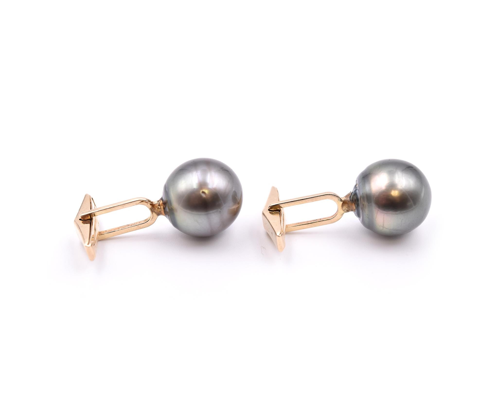 Designer: Custom
Material: 14 Karat Yellow Gold
Pearls: Round Tahitian Black Pearls
Dimensions: pearls measure 14.6mm-15.20mm
Weight: 12.75 grams