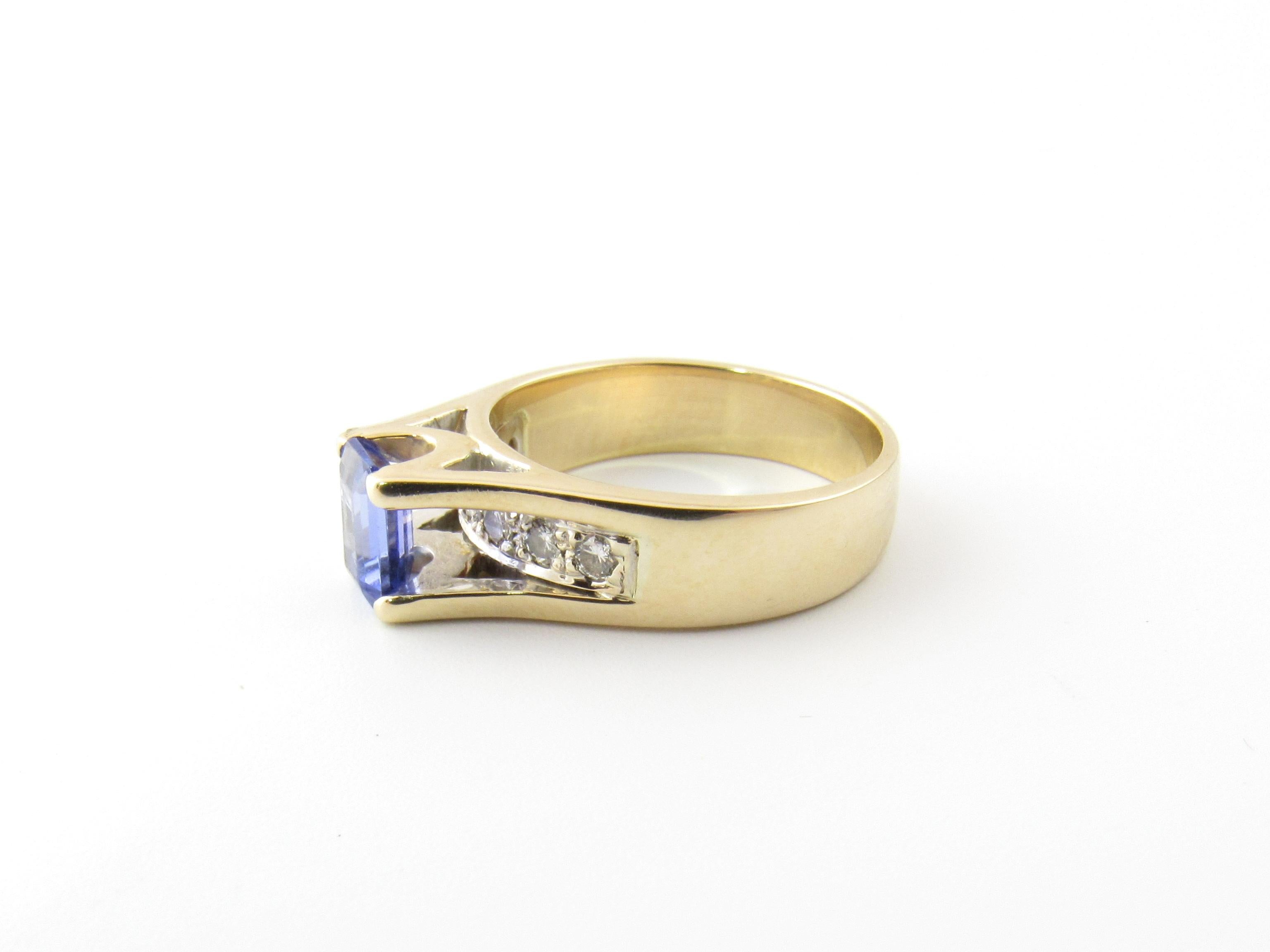14 Karat Yellow Gold Tanzanite and Diamond Ring Size 6.75-

This stunning ring features one tanzanite (7 mm x 6 mm) and seven round brilliant cut diamonds (.05 ct. each) set in beautifully detailed 14K yellow gold.  Height:  8 mm.  Width:  7 mm. 