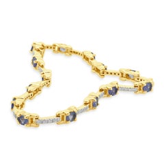 14 Karat Yellow Gold Tanzanite and Diamond Station Bracelet