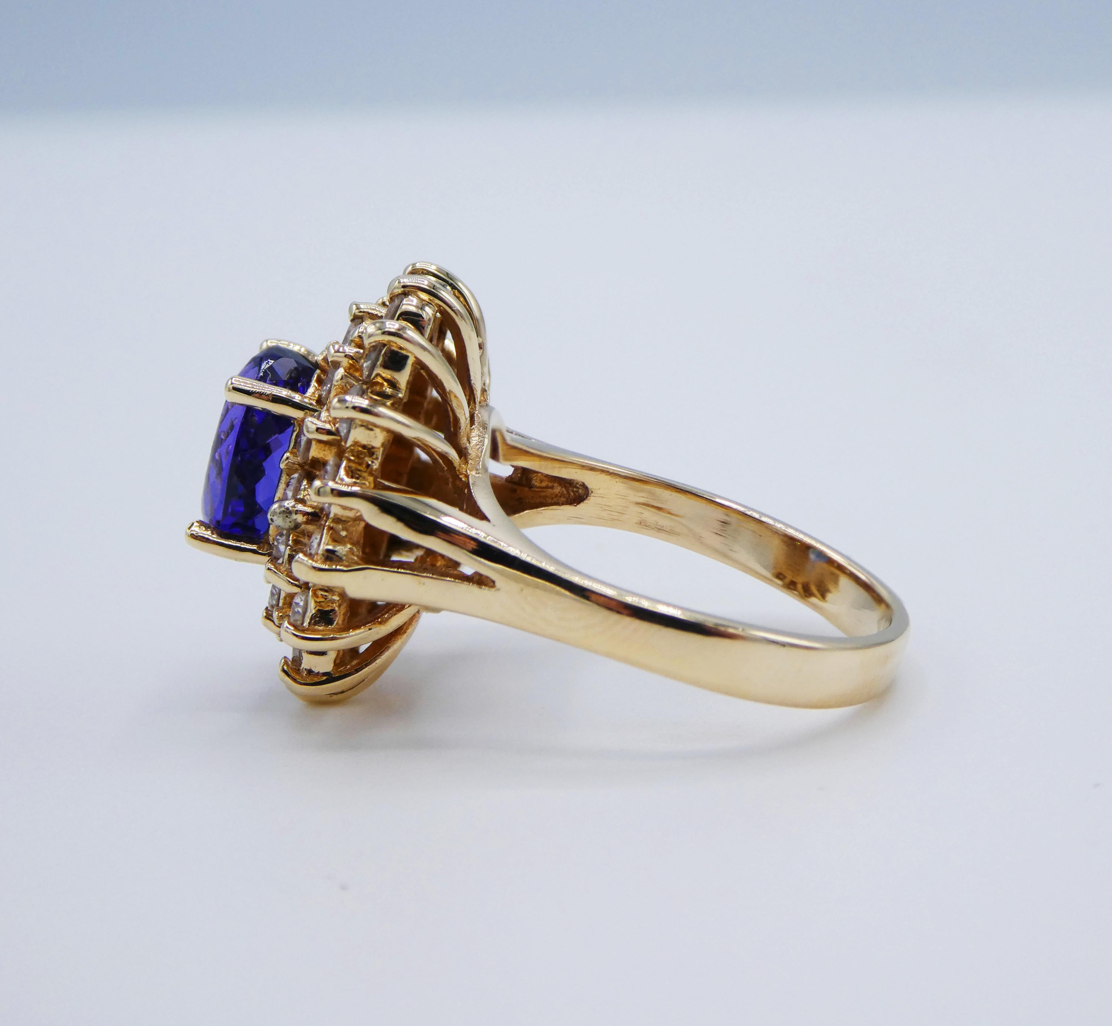 14 Karat Yellow Gold Tanzanite and Diamond Halo Cocktail Ring In Excellent Condition In  Baltimore, MD